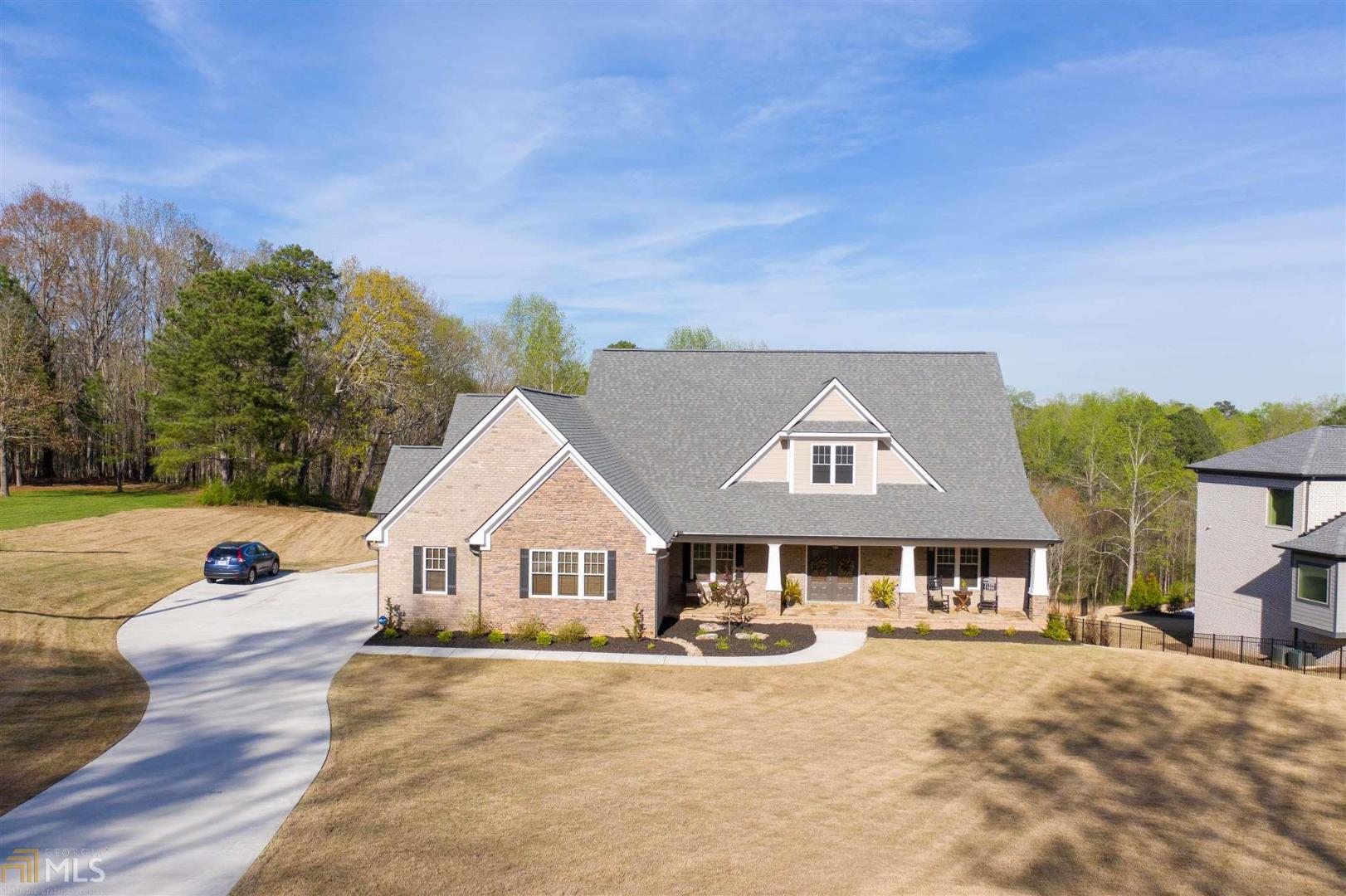 This gorgeous 4 sided brick home sits on over 2 acres and is in immaculate condition home has hardwood floors and tile throughout main level, kitchen has quartz counter tops, a large walk in pantry and over looks the living room and sitting area. Master bedroom is oversized and has access to the covered back deck. Complete with his/her walk in closets and gorgeous master bath. No HOA, close to dog park and community center with easy access to I-985!