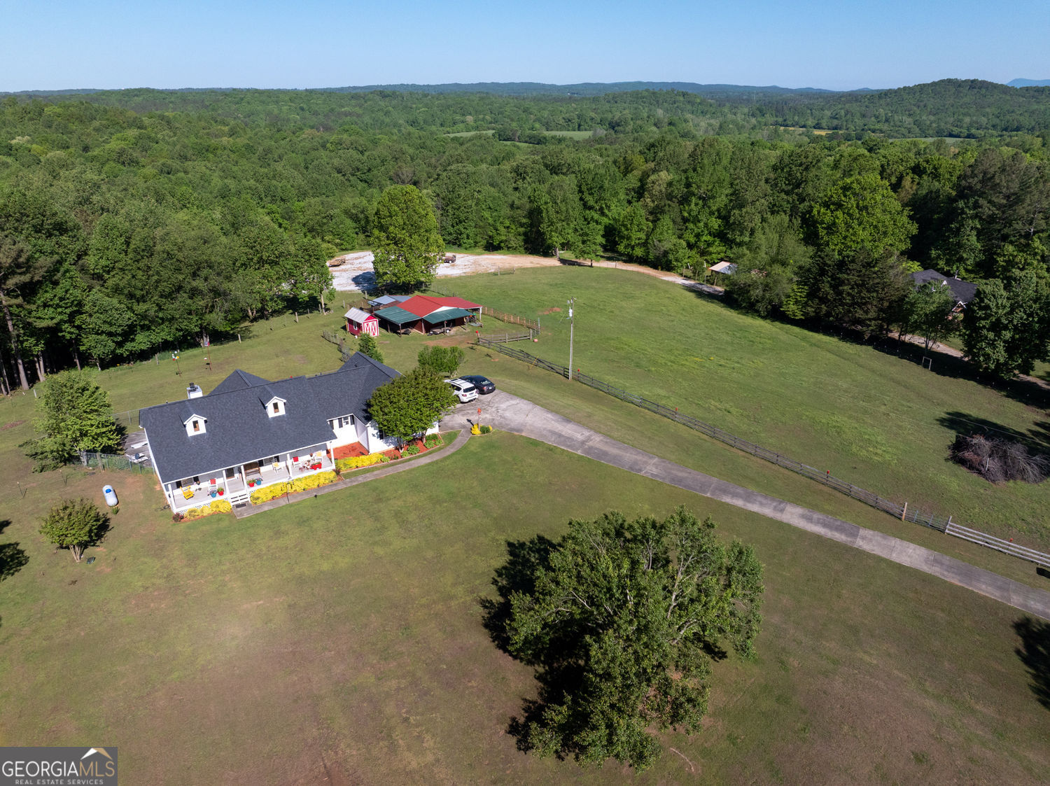 **Charming Farm - Perfect for Your Livestock!** Discover the charm of this exquisitely renovated farmhouse, complete with all the amenities (large pasture and barn)for your farm animals. The barn has a cement slab floor built in 2020 - equipped with running water and electricity, featuring two horse stalls, a hay shed, and a chicken coop, plus a workshop for your projects. Dive into summer fun with an inviting in-ground pool, highlighted by a diving board and a fire pit, perfect for gathering with friends and family under the sun. This home has been transformed with high-quality renovations: all outdated polybutylene plumbing lines were replaced in 2020, while the gourmet kitchen was beautifully updated that same year, showcasing stunning quartz countertops, brand new appliances, and a stylish backsplash. The luxurious primary bathroom was completely revitalized in 2021, now offering a new shower, elegant vanity, and modern flooring. Additional upgrades include state-of-the-art garage doors and openers with Wi-Fi functionality installed in 2020, along with new barn fencing (three-board and barbed wire) completed in 2021. The spacious sunroom with new windows is currently being enhanced. Step outside to a breathtaking yard that has been thoughtfully landscaped and meticulously maintained, featuring flourishing fruit trees. Plus, enjoy peace of mind with a roof that's just six years old. This enchanting property is not just a home; it's a lifestyle waiting for you to embrace! Beautiful Farm -Bring your farm animals. This beautifully renovated farmhouse has a barn, two horse stalls, a hay shed, and a chicken coop. The barn has running water and electricity, and it has a workshop. The home has an in-ground pool with a diving board and fire pit for fun days in the sun. This property has been renovated - all polybutylene lines were replaced in 2020, and the kitchen was renovated in 2020 with quartz countertops, new appliances, and backsplash. The primary bathroom was gutted and renovated with a new shower, vanity, and floor in 2021, new garage doors and openers with wifi in 2020, barn and fences in 2021 ( 3 board & barbed wire ), the large sunroom with new windows (being replaced now). The yard is landscaped and meticulously maintained with fruit trees. The roof is six years old.