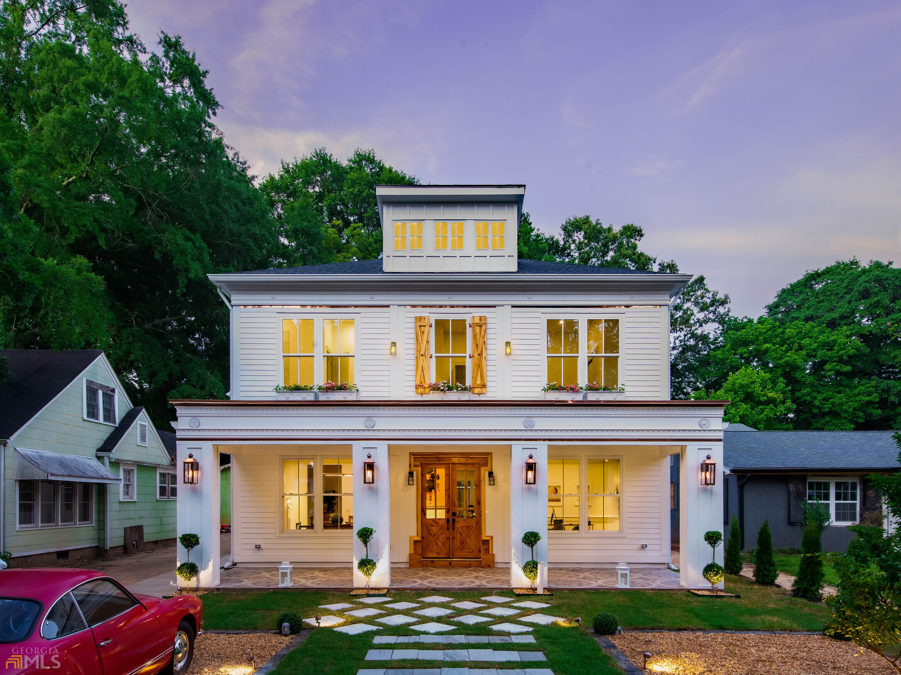 Welcome to Revival Grounds! A ONE of ONE custom home that effortlessly merges history & luxury while seamlessly nestling itself into the beauty of Historic East Lake! You'll be mesmerized at the street as you are greeted by this period correct Georgian Federalist Revival home boasting all the necessary dentil mouldings, triglyphs, & a 30 inch entablature stretching above the rocking chair front porch. Crosseted corners around the cedar stained front door welcome you HOME while the copper trim ties into the four custom built copper gas lanterns that illuminate the front gardens. Step inside to enter the grand entryway with custom inlays & slab tile flooring that lead to the stunning home office with 8 foot glass doors, custom crown moulding, & upgraded trim details & fixtures. Endlessly entertain in a one-of-a-kind Gourmet Kitchen that will impress even the most experienced Chef. Featuring a 57 inch dual faucet kitchen sink, built-in Miele coffee maker & Flat Screen Television, 80 inch Liebherr built-in Fridge, 100 bottle wine fridge, custom cabinets that all enjoy custom interior organization systems & automated lighting. The cooking wall is centered by the 36C slide in ZLINE Range & a custom stainless range hood that plays music via your favorite bluetooth device (yes I am serious). A walk-in pantry with custom cabinets & brilliant breakfast bar leads to the formal dining room that is primed & ready for your next family gathering. The open kitchen overlooks the stunning family room with double vaulted ceiling & custom moulding lit with inset LED lighting. Right off the family room, it's a seamless transition out onto the beautiful turn of the century courtyard-esque patio with 3 separate spaces to enjoy the outdoors year round! A main level en-suite bedroom could serve as a secondary owner's suite and is drenched with natural light. It enjoys a spa-like bath & beautiful closet! Upstairs retreat to the storybook ownerCOs suite & prepare to get inspired by the matchless & masterful attention to detail. Custom molding on a double vaulted ceiling in the bedroom as well as a custom lighting package, custom millwork, & tons of natural light! And then there is the absolutely stunning European Bath with one of a kind boutique walk-in commercial closet. Unwind after a long day in the huge soaking tub or the massive walk-in shower with dual shower heads and 6 way diverted jet system. AND if you need a little extra privacy just hit the remote controlled privacy curtain! You literally have to see this Owner's Suite to believe it! Limitless potential lies in the unfinished 670 sq.ft. in-law suite above the detached 2-car garage. The private & HUGE backyard is prepped & pool ready (prelim design from Evantures Pools included). With the custom gallery lighting package, 9 inch European Oak Hardwood Floors, Period Correct Trim Package, & high-end METICULOUSLY crafted finishes throughout, this home is the perfect combination of historical elegance and modern sophistication where every single detail has been realized. All nestled in a location that CAN. NOT. BE. BEAT. Just a few short steps out your front door to McKoy Park, Oakhurst Village, 2nd+Hosea, & East Lake Park. Every home has a story, but REVIVAL GROUNDS is curating a new narrative & elevating the standard for what HOME can be. Brilliant!