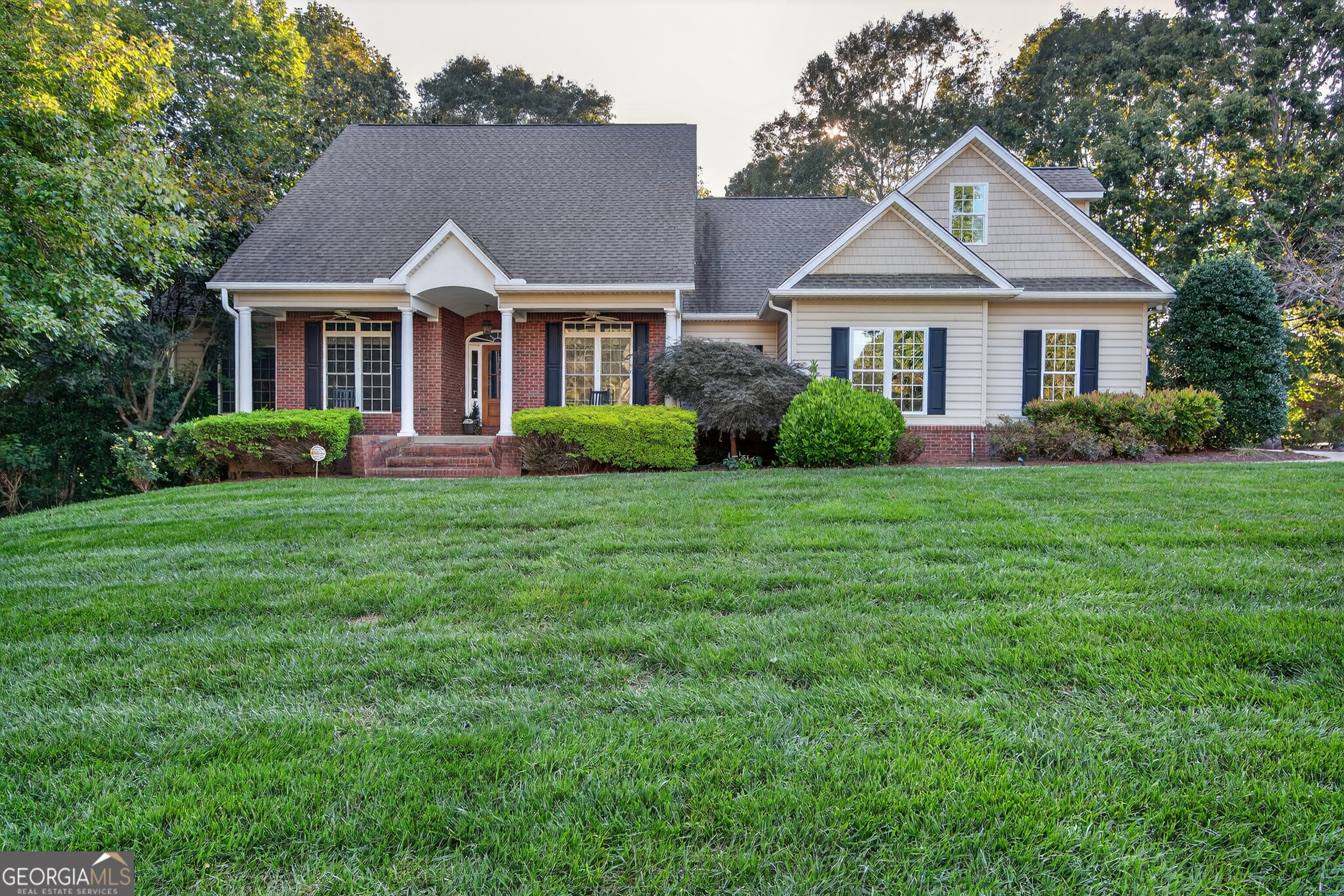 Welcome to 4705 Rivers Edge Drive, a beautiful corner-lot home in Rivers Edge Subdivision. This residence offers a thoughtful layout with the primary suite conveniently located on the main floor, featuring a newly renovated spa-like bathroom. Two additional bedrooms on the main level each include en suite bathrooms, creating comfort and privacy for family or guests. The main living areas are anchored by a newly renovated kitchen with modern finishes, seamlessly connected to the open dining and living spaces. An extended two-car garage provides ample room for larger vehicles or storage. The fully finished basement expands the home's living space with a large kitchenette, an entertainment room with its own en suite bathroom, living area, private bedroom, storage closets, 3 sided concrete storm/storage room, and double door storage room accessible to outside. Perfectly blending modern updates with flexible living options, this home is ideal for entertaining and family living all in the heart of North Hall.
