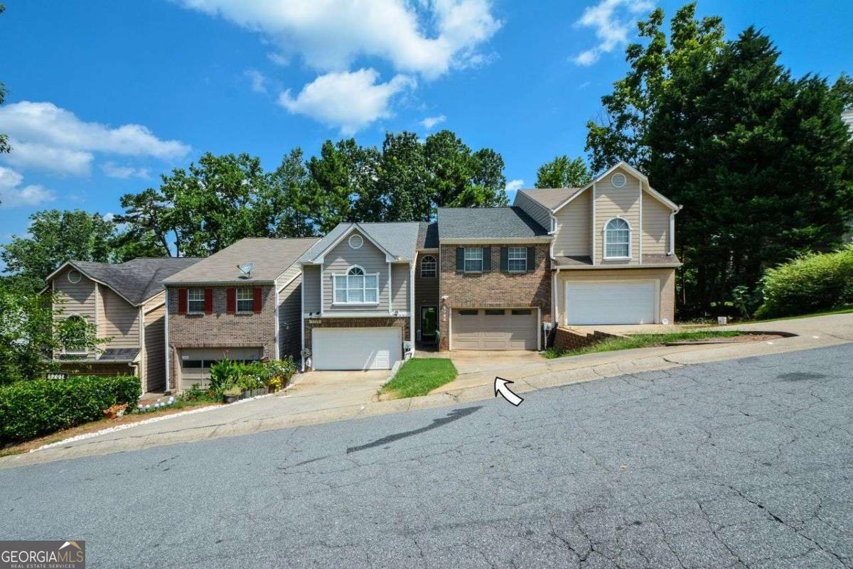 1703 Grist Mill Dr. is waiting for you! This spacious 3 bedroom, 2.5 bathroom Townhouse is located in the heart of East Cobb with easy and quick access to I-75. Your home is ideal for cozy family living and entertaining family and friends. As you enter the front door and pass through the expansive foyer, you enter a 2-story family room with a gas fireplace, an open kitchen with bar seating and a view of the family room. After you have prepared your meals in your conveniently located kitchen with a full appliance package, enjoy your breakfast, lunch and dinner in your separate dining room that flows to a cozy deck. The loft/landing upstairs is perfect for your home office and leads to a laundry room and two roommate suites with garden tubs and separate showers. You will delight family and friends in your spacious finished terrace level which is perfect for a media room with a closet or a third bedroom with separate entrance and extra unfinished space ideal for a fitness center and additional storage. DO NOT PROCRASTINATE AS YOUR HOME IS PRICED TO SELL!