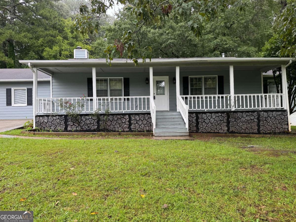 Charming 3 Bedroom, 2 Bathroom Home with Modern Upgrades & Great Location! Welcome home to this beautifully remodeled 3-bedroom, 2-bathroom gem featuring fresh paint, new carpet, updated lighting, and all-new vanities and countertops throughout. The spacious living room offers a cozy wood-burning fireplace, perfect for relaxing evenings, and flows into a bright eat-in kitchen with brand-new appliances. The primary suite includes a private bathroom and a walk-in closet. Enjoy outdoor living on the covered front porch or in the fully fenced backyard-ideal for entertaining. The extended driveway provides ample parking for multiple vehicles. Conveniently located near a park with scenic walking paths and just minutes from local shops, dining, and other amenities, this home has everything you need-inside and out. Don't miss your chance to call this move-in-ready home yours!