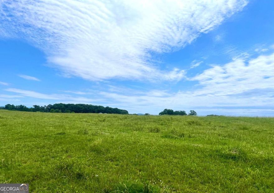 Looking for the "perfect" place to retire? A 'forever" home with unbelievable views and sunrises? UNPARALLED AND EXQUISITE!! Rarely does a piece of property so uniquely beautiful hit the market. Nearly 12 acres of rolling countryside, with mountain views appearing to the north and east, ideally located in a corridor of fine homes, upscale horse farms, and tranquil small farms, at an incredibly affordable price point.  Build your "dream" home, mini-farm or horse farm on this gorgeous tract and become the envy of your urban neighbors as they argue about traffic, crime, property taxes, noise and the desire to ""escape it all." With a five minute drive to i-75 access, hospital, restaurants and shopping, and located in a highly desired school district, golf club on same road, Hunts Gin road offers the BEST of all worlds. Experience tranquility and natural beauty as you awaken with the sunrise over the distant mountains, the sound of neighbors horses whinny when its feeding time, perhaps a rooster crow on occasion, the gentle stream on your property, birds chirping and NATURE'S SILENCE! The peacefulness and serenity is unmatched, yet with a five-minute drive to -75, access to the "rest of the world" is ever-present. Your heaven-like 360 degree views are horse and cattle farms, pastures and mountains, and yet so close to conveniences.  Ask us about recommended lenders and builders, we have those at our fingertips ready to assist you in your journey if needed. There will only be "four" total parcels offered in this exclusive area, so hurry to pick your favorite!
