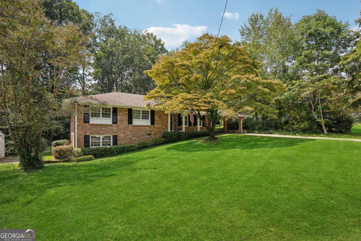 Enjoy One-Level Living in this 4-sided Brick Ranch and located in the sought after Livsey Elem School district of Tucker. Imagine living in the active, fun and friendly neighborhood of Lake Ivanhoe, surrounded by Henderson Park, Tucker Nature Preserve, Lucky Shoals Park, and Heritage Golf Course. This 3 Bedroom / 2 Bath Ranch home on a huge basement has so much space for entertaining, work from home, plus kids and fur kids. Hardwoods throughout and new hardwoods added in the kitchen. The kitchen has been completely renovated from top to bottom with granite countertops, tile backsplash, SS appliances, and breakfast nook. Large laundry room located off the kitchen has built in cabinets and pantry storage with backdoor access to the deck. Welcome your family and friends into the bright, open living room and dining room with plenty of space to entertain. Large en-suite master with a renovated bath with tiled tub/shower, tile floors, new vanity and built in cabinetry. Two additional bedrooms with large closets share a beautiful hall bathroom updated with new vanity, toilet, mirror and shower. French doors from the dining area lead to a cozy Screened Porch with vaulted ceiling where you can enjoy coffee or cocktails! And walk right out to a deck that runs the length of the house with space for grilling and gathering. But don't stop at the main level; the Daylight Basement provides the potential to nearly double your living space with a finished space that's perfect for your man cave, movie room, exercise room or a combination of all three. There's tons of storage, a kids indoor play area, crafting, or a workshop. Sitting on one of the best level lots in the neighborhood, you have a fenced backyard ideal for gardening, playing catch or fetch, and plenty of room to add a Pool. A true gem close to Downtown Tucker, CDC, Emory, Restaurants, Shopping, Tucker Library, Stone Mountain Park and easy access to I-285, 85 and Hwy 78. Don't miss out on your dream home!