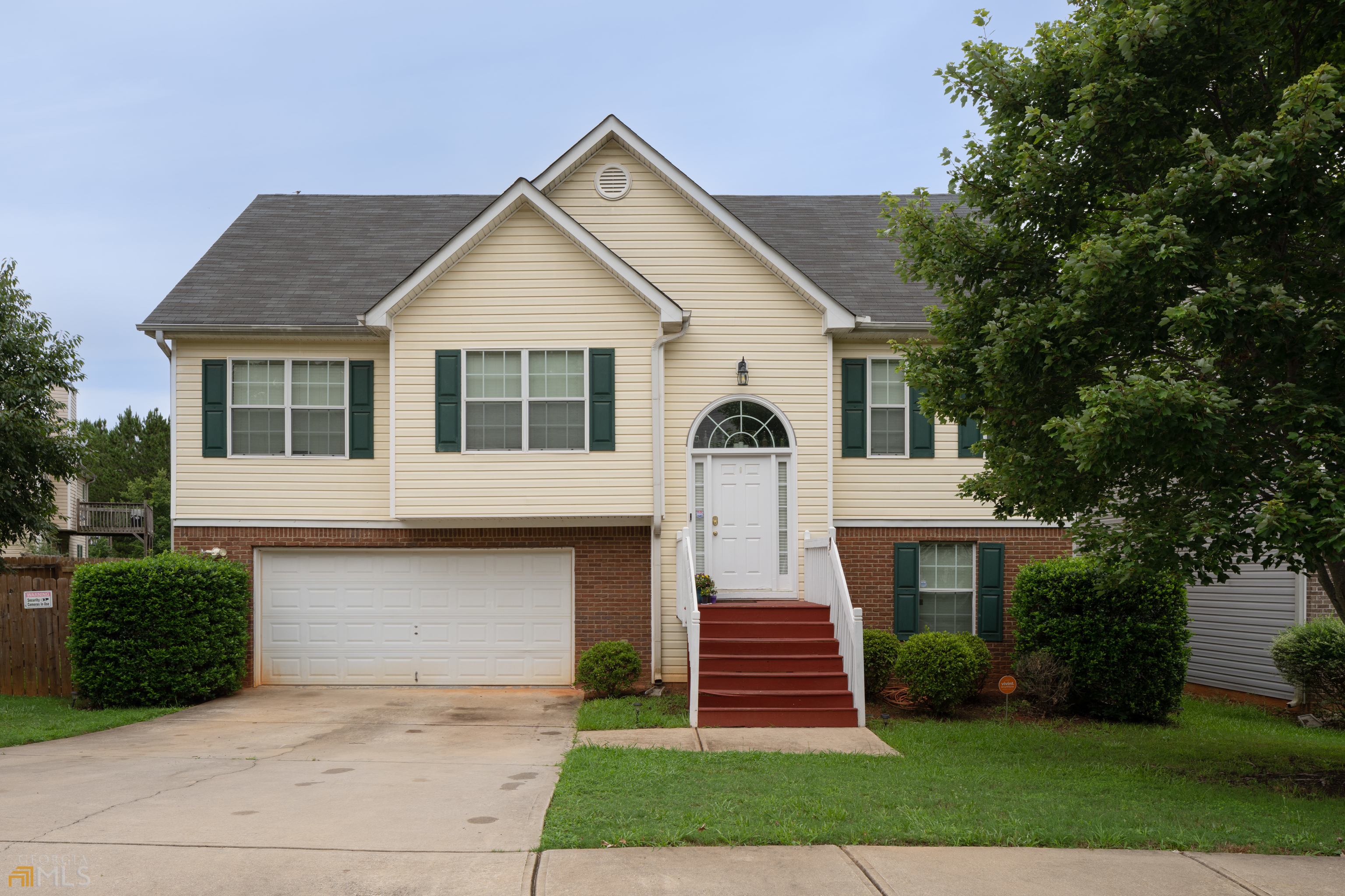 Don't miss your chance to own this wonderful home right off the interstate and within walking distance to Tanger Outlets! This 5 bed, 3 full bath house features an open concept floor plan, two master bedrooms, and a quaint deck off of the kitchen perfect for grilling. The master bathroom features a double vanity, a separate shower, and soaking tub. The upstairs has 3 beds and 2 full baths whereas the downstairs is 2 beds and 1 full bath with its own private entry perfect for an in-law suite. Beautiful granite countertops, updated cabinetry, and stainless steel appliances are in the kitchen. This home is one of the largest in the neighborhood and has an oversized garage with storage room. The private backyard is large and perfect for entertaining guests and friends. Schedule your appointment today!
