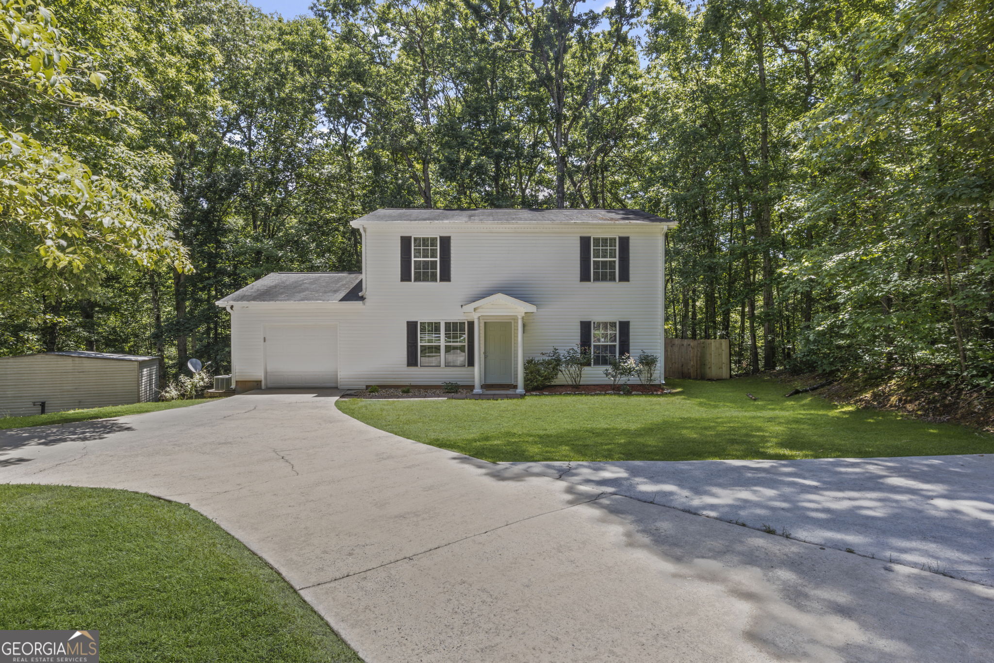 MOTIVATED SELLER FOR THIS CUTE HOME With 3 Rooms And A Full Bath Upstairs - Primary On Main With Large Closet & Bath. Well maintained 2 Story on 0.6 acre with deck overlooking fenced backyard. Kitchen has lots of storage in wood cabinets. Black electric appliances. Cute House! Move in Ready with new carpet and paint! Great location between Whitesburg and Newnan.