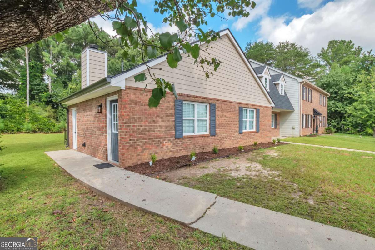 Totally Renovated End Unit Townhome 1/4 mile from Southern Regional Medical Center with No HOA restrictions! Everything is new on this charming ranch style home. Brand new 30 year architectural roof, Hardie plank siding and gutters. New insulated windows and R-38 attic insulation=Low utility bills! No HOA fees or covenants. New natural gas water heater and low flow fixtures. New LVP flooring, light fixtures and paint throughout. Beat the heat with the brand new HVAC and ceiling fans in every bedroom. Great neighborhood and excellent, convenient location. Private back yard with large storage closet and wide 2 car driveway!