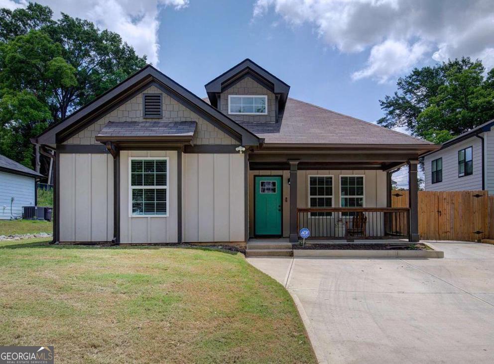 SOLD NEW FOR 335k in 2023 NOW PRICED AT UNDER 250k! In 2025 this steal of a deal is BETTER THAN NEW offering a modern style ranch home in the heart of Cartersville yet convenient and easy access to all of Atlanta, North Georgia and Alabama. Spectacular condition as if not even inhabited plus all the upgrades from easy care and low maintenance LVP flooring, upgraded fixtures, granite counters PLUS stainless steel electric range with built in air fryer, recessed lighting throughout, built-in electric fireplace with lighting package, double vanity in master with large tile shower, and the laundry doubles as a mud room to help keep your new home spotless. Extended parking pad with drive around access all the way to the rear for easy grocery unloading and patio along with a privacy fenced yard. Located in a growing area with loads of lifestyle improving amenities within walking distance including Rotary Park, North Towne Park, Clarence Benham Park, Cartersville Public Library and the Booth Western Art Museum. Mellow Mushroom is just a few blocks away then head over to ATG CrossFit to burn off those calories or hike the Etowah Native American Mounds Historic Site or the many trails nearby at Lake Allatoona. For the sports enthusiast check out Gatewood Disc Golf, Woodland Hills Golf Club or the INCREDIBLE Lake Point Sports Complex - the massive athletics venue featuring an array of fields & courts, a wakeboarding lake & sports camps serving more than 30 sports year-round, including baseball, basketball, volleyball, soccer, lacrosse, gymnastics and cheer! RARE to find such an exceptional value, nearly new home with such incredible lifestyle enhancing features within mere minutes of your new home. MAKE YOUR MOVE on this life improving property before someone else scoops it up!
