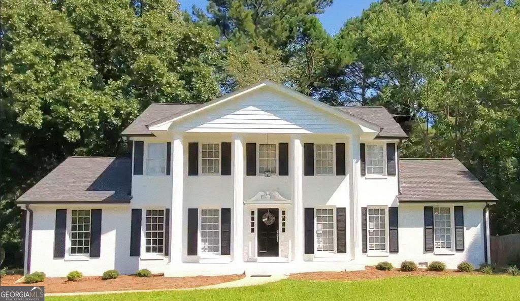 Photo of 7120 Rockbridge Road, Stone Mountain, GA 30087 (MLS # 10755880)