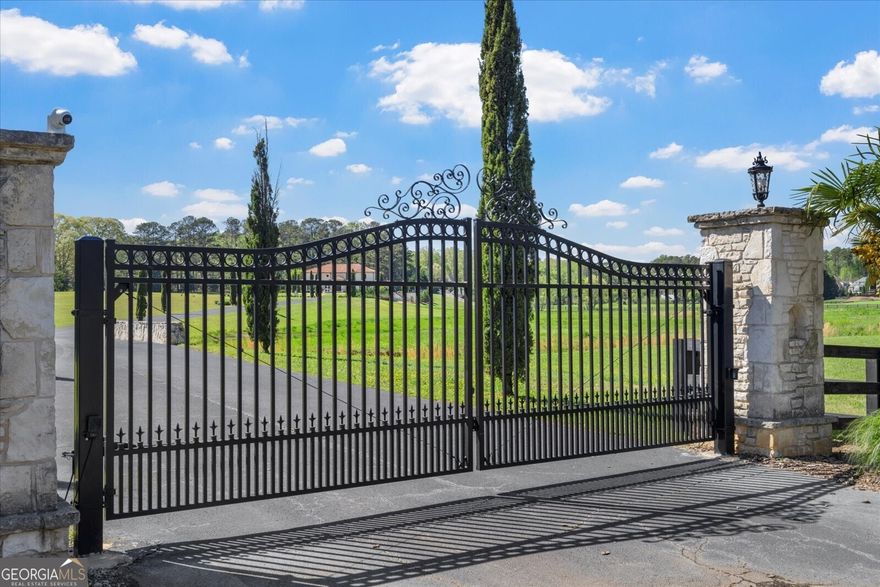 ENTER A DREAM WORLD AT VILLA DE CIELO-WHICH MEANS HOME IN HEAVEN! THIS MAGNIFICENT CUSTOM BUILT TUSCAN INSPIRED GATED ESTATE HOME ON 21 ACRES OFFERS LUXURY & CLASSIC ELEGANCE AT ITS FINEST/ THIS ESTATE HAS BEEN FEATURED IN MANY MAGAZINES AS ONE OF THE TOP ATLANTA HOMES, AS WELL AS IN MANY FEATURE FILMS & TV PRODUCTIONS/ IT IS A TRUE ITALIAN ESTATE AS ORIGINAL OWNERS FLEW IN ARTISANS FROM ALL OVER THE WORLD TO COMPLETE THE HAND PAINTED FRESCOS/BURLED WALNUT SITE FINISHED CABINETRY/HAND CARVED MAHOGANY DOORS FROM EUROPEAN CASTLES/SOLID CHIPPED LIMESTONE EXTERIOR/FLASH FIRED CLAY ROOF/18TH CENTURY HAND HEWN BEAMS FROM THE SAVANNAH RIVER/ALL PERIOD LIGHTING & CHANDELIERS/HOME IS ON PUBLIC WATER BUT HAS AN AMAZING ARTESIAN WELL THAT SERVICES IRRIGATION TO THE PROPERTY & CAN BE USED IN THE HOME/CURRENT OWNERS HAVE RENOVATED HOME TO INCLUDE 48 KW WHOLE HOME GENERATOR/ALL NEW INSULATED ANDERSON WINDOWS/RENOVATED POOL/SPA/PEBBLETEC & EQUIPMENT/ADDED FABULOUS TREX DECK SYSTEM OVERLOOKING ADJACENT LAKE & LAND/NEW HVAC SYSTEMS/WATER HEATERS/NEW LANDSCAPE LIGHTING TO THE STREET & TOTAL BACKYARD & GARDENS/ADDED LARGE CATERING PANTRY/2ND LAUNDRY UPSTAIRS INCL. ADDITIONAL CLOSET SYSTEMS/NEW FLOORING IN BEDROOMS & TERRACE LEVEL/NEW KITCHEN APPLIANCES/NEW UPGRADED HOME THEATER SYSTEM/GORGEOUS OVER SIZED BAR IN TERRACE LEVEL W/GLASS FRONT WINE CELLAR/COOLER/ENJOY HEATED BATH FLOORING THRUOUT/ADDED GORGEOUS FULL POOL BATH ADJACENT TO NEW PORCELAIN TILED CABANA-THERE IS SO MUCH TO SEE HERE AT VILLA DE CIELO! THE GROUNDS & VIEWS ARE AMAZING/ YOU DO HAVE THE ABILITY TO BUILD ADDITIONAL HOMES ON THE LEFT SIDE OF THE PROPERTY/ HORSES CAN BE HERE TOO! RECENTLY DONE ASPHALT DRIVEWAY CAN ACCOMMODATE 2 CARS GOING SIDE BY SIDE! THIS HOME HAS ITS OWN FIRE HYDRANT TOO!  ENERGY EFFICIENT- THE PLASTER WALLS ARE SO THICK IT HOLDS THE HEAT OR COOL AIR AMAZINGLY! YOU MUST SEE THIS ELEGANT ESTATE TO BELIEVE IT!    https://iframe.videodelivery.net/ce95506e2eb9caea14dd20e84c0885a5