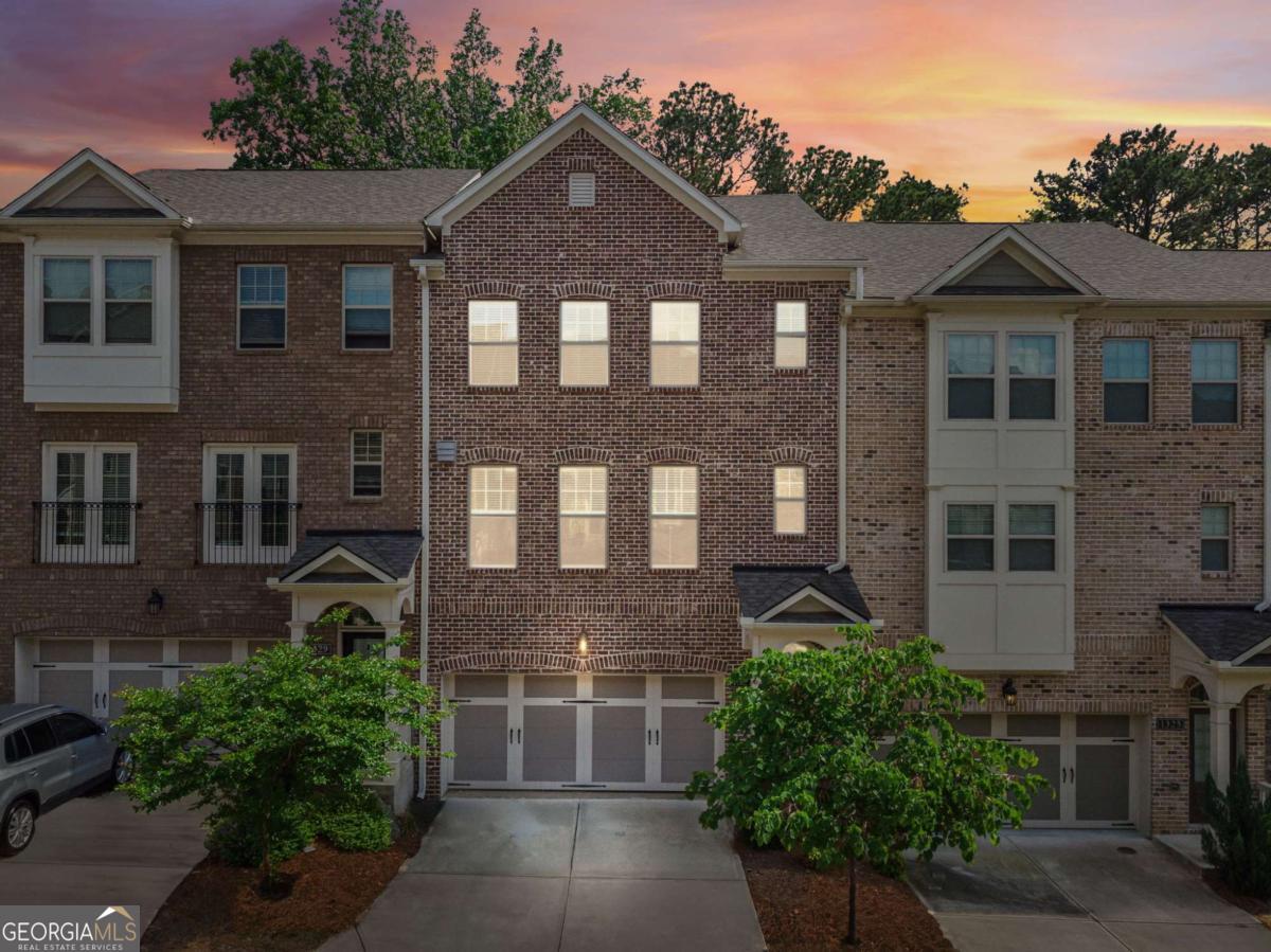 Experience the Best of Brookhaven Living! Step into this beautiful 3-level townhome tucked inside the gated Evins Walk community, where privacy and convenience meet modern comfort. Whether you're looking for a forever home or an investment opportunity, this residence offers the perfect balance of lifestyle and potential. Imagine starting your morning with coffee on the spacious deck, overlooking a peaceful tree-lined backdrop. Inside, you'll be greeted with freshly painted walls, LVP flooring, and an open-concept layout that's perfect for both cozy evenings by the fireplace and entertaining friends. The kitchen is fully equipped and ready for your culinary adventures-complete with refrigerator, washer, and dryer included-while the walk-in pantry keeps everything neatly organized. Upstairs, the primary suite is a true retreat with an oversized shower and thoughtful finishes designed for comfort and relaxation. The terrace level offers a flexible space that can easily become a private guest suite, home office, or workout room, adapting to your lifestyle. Outside, the two-car garage and brick front curb appeal complete this home's inviting presence. And the location? Unbeatable. You're just minutes from Emory University, the CDC, top-rated hospitals, shopping, dining, and major commuter routes, placing the best of Brookhaven and Atlanta at your doorstep. Investor-Friendly Bonus: With no rental cap met and estimated income of $4,000/month, this home is as smart as it is stylish in a community where most neighbors are owner-occupants. Evins Walk isn't just a home-it's a lifestyle. Come see why this rare opportunity won't last! **Please use directions in listing as GPS is not accurate.**