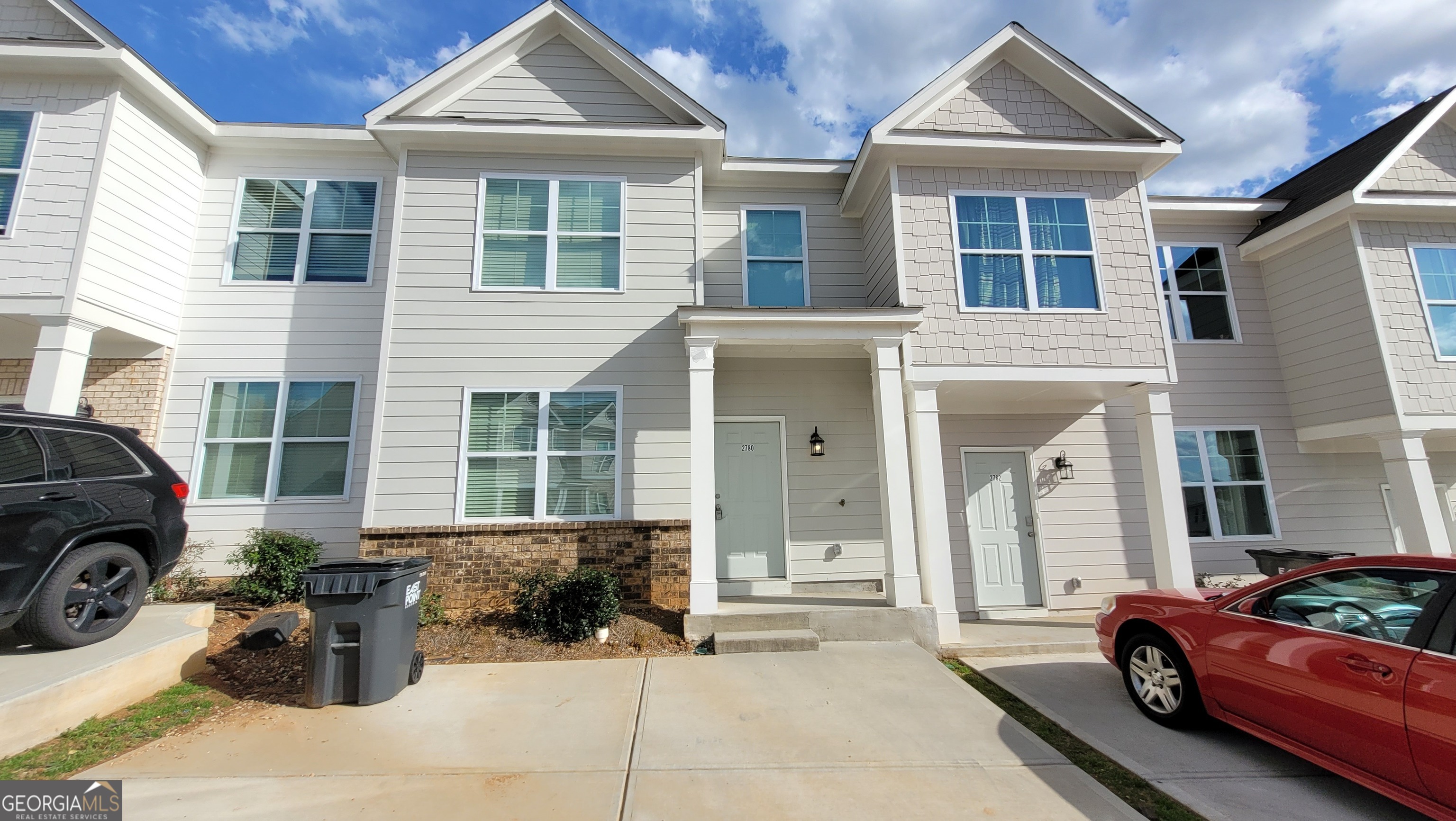 This stunning 2023-built townhome features modern open-concept living, perfect for entertaining. The gourmet kitchen boasts granite countertops, a spacious island, and stainless steel appliances. Enjoy an intimate dining room, laminate flooring throughout, and a luxurious master suite with a walk-in closet and private bath. Conveniently located near the airport, I-285, and Camp Creek Marketplace, offering Publix, Starbucks, Lowe's, dining, and more. Ideal for both owner-occupants and investors. Don't miss this move-in ready gem!