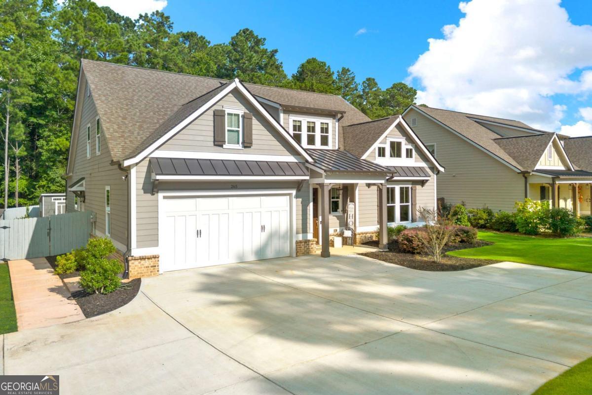 Stunning farmhouse-style home tucked away in a charming corner of Cobb, featuring the largest floorplan in sought-after Holland Farm! The current owner has made thoughtful upgrades throughout, including custom closet systems, new light fixtures, gutter guards, quartz countertops in kitchen and bathrooms, LVP upstairs, gazebo and shed! The main level offers 10' ceilings, elegant 8' paneled doors, an upgraded 10" trim package, and a spacious primary suite. The beautifully designed kitchen includes high-end Samsung stainless steel appliances, stone countertops, soft-close cabinetry with under-cabinet lighting, a large island, tile backsplash, and a cozy breakfast area. Two additional bedrooms and a breakfast room complete the main floor. Upstairs, you'll find a fourth bedroom with its own en-suite bath, a full media room, a versatile study/library, and generous attic storage-plus the potential for a second upstairs bedroom. The garage features additional space ideal for a workshop. Exterior highlights include professional landscaping with an irrigation system, a large fenced yard, a screened-in porch with a metal roof, and newly added gazebo and storage shed-perfect for relaxing or entertaining. This home is truly move-in ready with exceptional attention to detail inside and out!