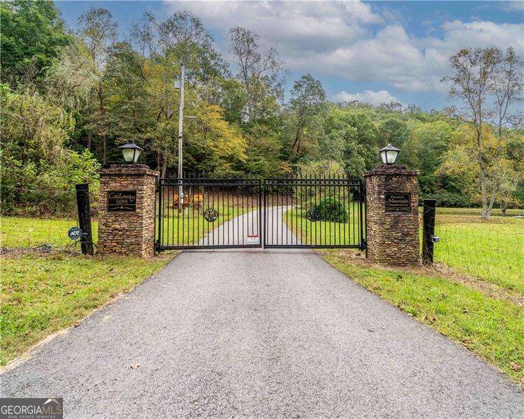 This amazing lot in gated community offers 5+ acres of Private Mountain living, the community is gated and has a pond for enjoyment, paved roads make this property accessible for all, come see this private wooded lot gently sloping wooded property