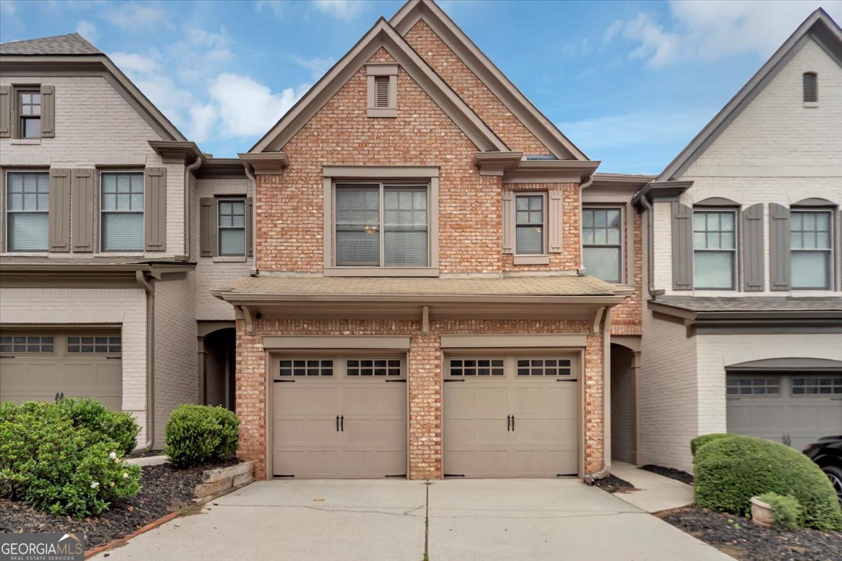 Welcome to this beautiful 1,985 sq. ft. townhouse located in a private, gated, and impeccably maintained community. Inside, you'll find an open floor plan with rich hardwood floors, granite countertops, and all stainless steel appliances-including a modern touchscreen refrigerator. The cozy fireplace lights instantly with the flip of a switch, adding warmth and charm to the living space. Upstairs features a spacious master suite and a versatile office nook or sitting area conveniently located in the hallway-perfect for remote work or quiet reading. With a 2-car garage and a spotless, move-in-ready interior, this home offers modern comfort in a serene, secure setting.