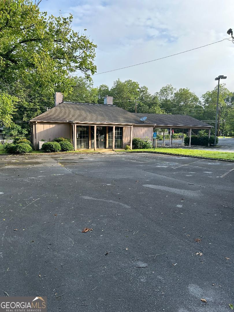 2098 sq ft building, former bank that includes a vault and a drive through canopy, located on over an acre on an ideal corner lot, huge paved parking lot, ideal for your business venture. Possible OWNER Financing with 30% down!