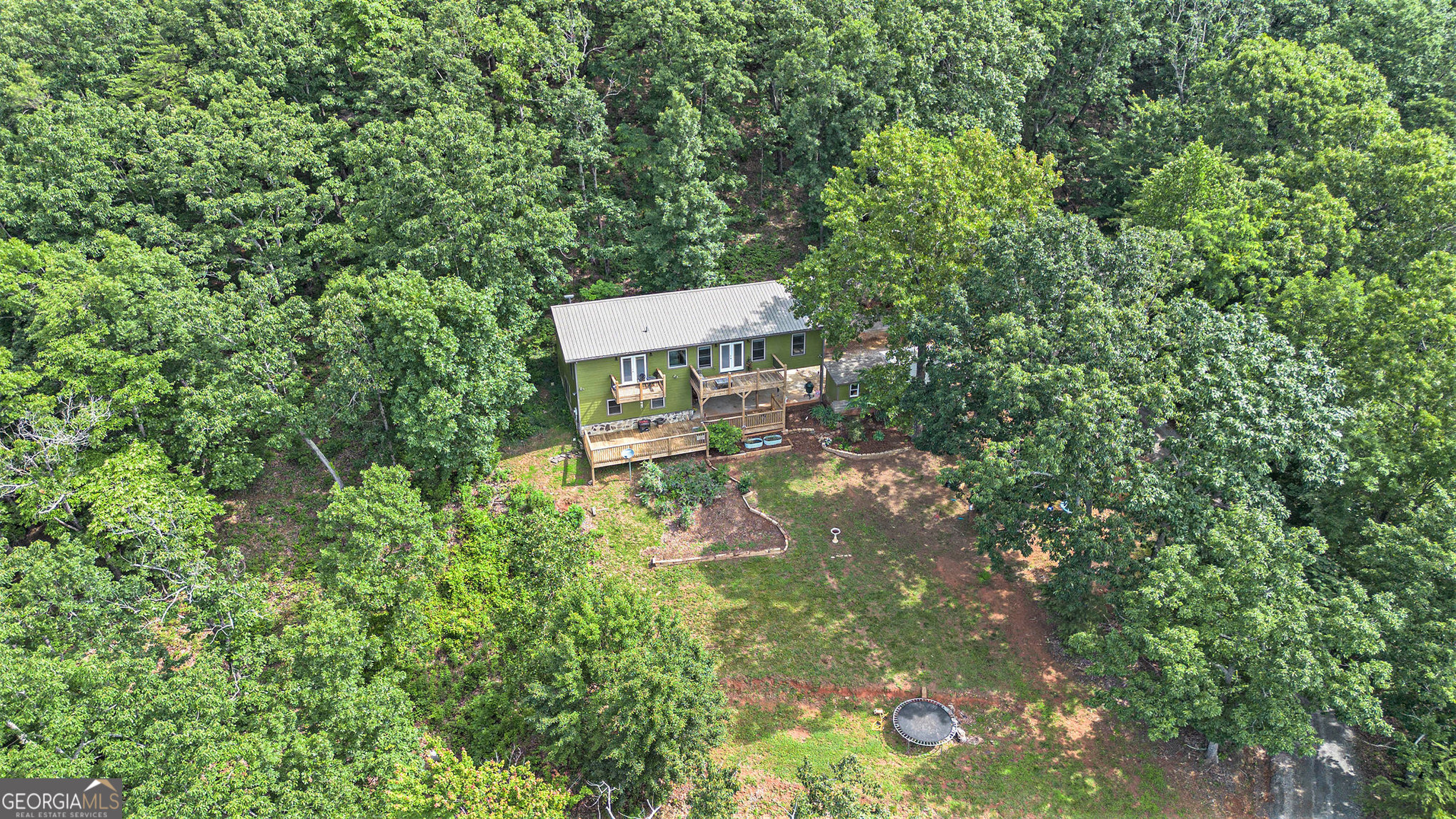This home offers 4 bedrooms, year-round mountain views, almost 10 acres, a separate barn with workshop, cleared front yard for gardening, and is located below Wauka Mountain among large residential tracts. The upstairs addition was completed in 2020. Outdoor laundry shed, 50x24 barn, carport which can be used for parking or outdoor entertaining. Use for a single residential parcel or add a second home for family, friends, rental, etc- there is a gentle building site higher up the mountain that would offer the same spectacular views.