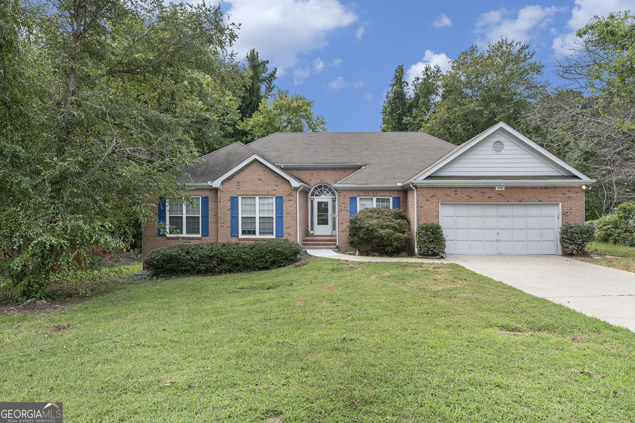 This stunning four-sided brick ranch offers 3 bedrooms and 2.5 bathrooms, combining timeless charm with modern comfort. The spacious eat-in kitchen is perfect for family meals, while the inviting family room features hardwood floors and a cozy fireplace. The oversized primary suite boasts a trey ceiling, a generous walk-in closet, and a spa-like ensuite with a double vanity, garden tub, and separate shower. Enjoy outdoor living on the large deck overlooking a beautifully landscaped, private backyard-ideal for relaxing or entertaining. Nestled in a quiet, welcoming neighborhood with abundant natural light, this home offers exceptional curb appeal and no HOA. A two-car garage completes this must-see property.