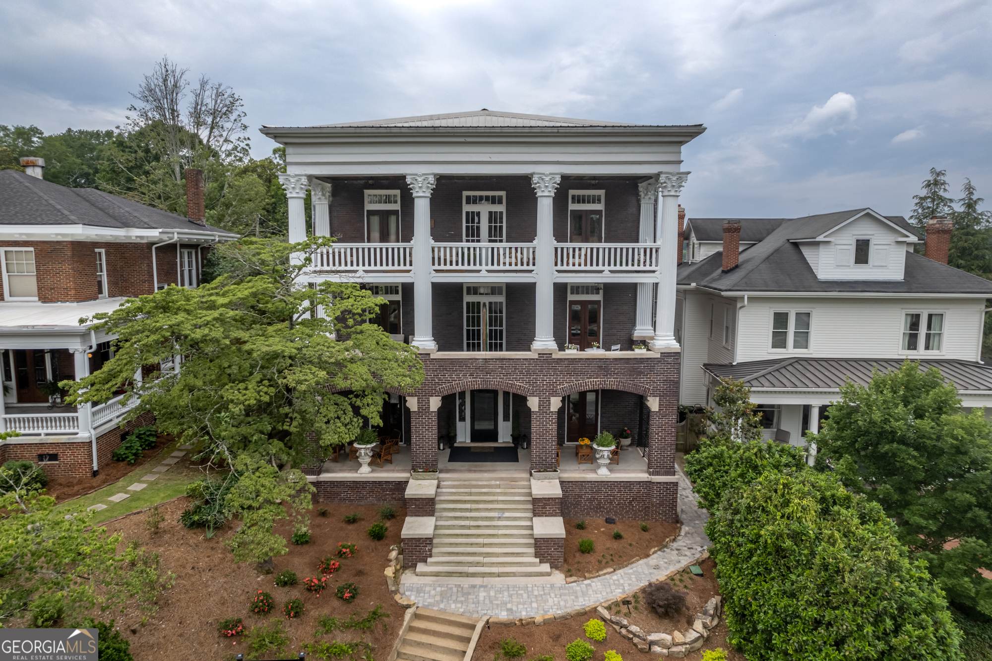 Looking for the convenience of downtown living? Come see the Penthouse Unit at the Bella Vista Condominiums in the historic Between the Rivers neighborhood. This iconic building was built in the early 1900's with Greek Revival architectural style. Bella Vista is known for the beautiful Corinthian columns across the front, french doors leading onto the large porches and the amazing views of the clocktower and downtown Rome. This condo features 10' ceilings, spacious layout with 3971+/- sqft, wide plank hardwood floors, 2 private side porches, a 400 sqft front porch, new wiring, new plumbing, new HVAC system, sprinkler system, fire alarm system, 50 gal water heater and spray foam insulation. Stroll to downtown for restaurants, entertainment, or hit the trails to Ridge Ferry Park and the Rome Braves Stadium. Downtown living offers a convenient and active lifestyle. High speed internet with 1.2 gig download speed, water, sewer, trash pick up, lawn care, and exterior maintenance are included with the rent. Tenant would be responsible for the electric and gas services. This penthouse condo can be rented furnished for $4,000/month or unfurnished for $3,500/month. There are around 80 steps up to the penthouse unit. The building does not have an elevator. All parking is on the street. NO PETS ARE ALLOWED