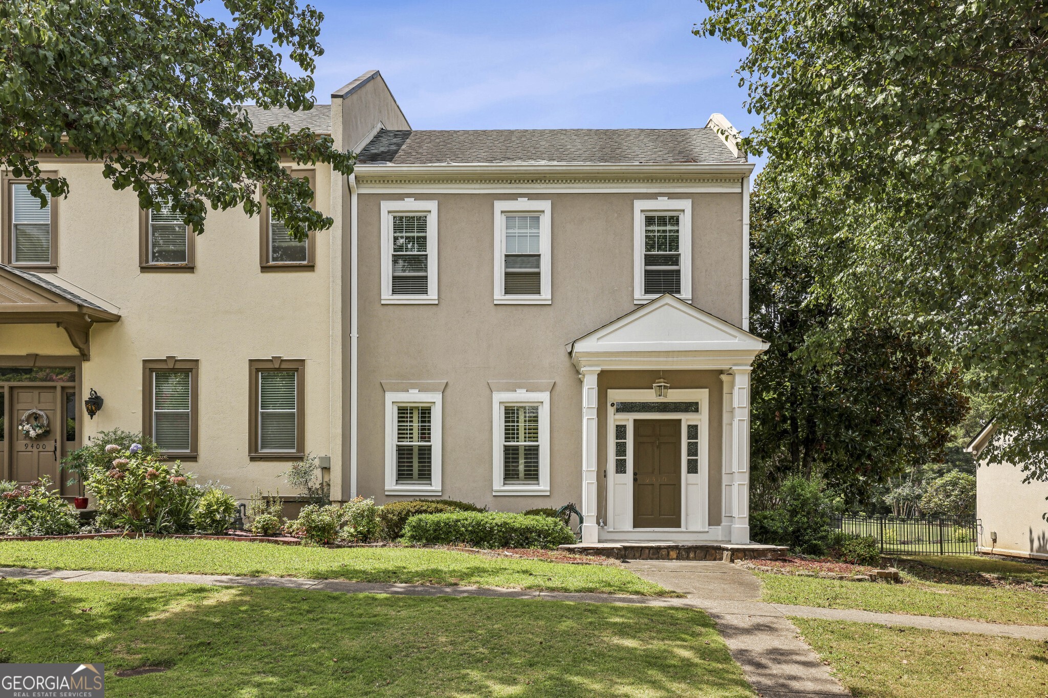 Charming Johns Creek End Unit Townhome! Zoned for Top-Rated Schools and nestled in a community with a Pool, Playground, and Tennis Courts, this home offers convenience, comfort, and endless lifestyle perks. Just minutes to the Chattahoochee River, Jones Bridge Park, and RiverPines Golf Course, you'll love being close to both recreation and daily necessities. Inside, you'll find High Ceilings, Crown Molding, and a Well-Designed Layout that provides plenty of space and flexibility. To the left, the Formal Living Room makes a perfect Flex Space or Home Office if you don't need two living areas. The Formal Dining Room, ideal for entertaining and making memories, flows into the Updated Kitchen with White Cabinets, abundant storage, Granite Countertops, and a charming Breakfast Nook surrounded by windows, Custom Built-Ins, and Wooden Shutters. The Fireside Family Room is the true heart of the home, featuring Custom Built-Ins on either side of the fireplace and walls of windows that let Natural Light pour inside. Step out to your Private Enclosed Patio Greenroom, perfect for gardening or enjoying Al Fresco Dining year-round. Upstairs, the Primary Retreat offers a spacious bedroom with an Updated Ensuite Bathroom showcasing a Marble Vanity, tons of storage, a Large Glass Shower with Bench, and a generous Walk-In Closet. Two additional bedrooms share a beautifully Updated Full Bathroom, and one connects to a bonus room perfect for a Home Office, Media Room, or Playroom. Additional standout updates include Brand New Carpet Throughout plus a Newer HVAC and Water Heater, giving you peace of mind and move-in ready comfort. Outside, enjoy a Private Screened Porch, a grassy yard, and a Two-Car Garage. All this, plus close proximity to Medlock Corners Shopping, Target, Home Depot, Whole Foods, coffee shops, and local restaurants. Situated in one of Johns Creek's most desirable communities, this home combines location, lifestyle, and modern updates an opportunity you won't want to miss!