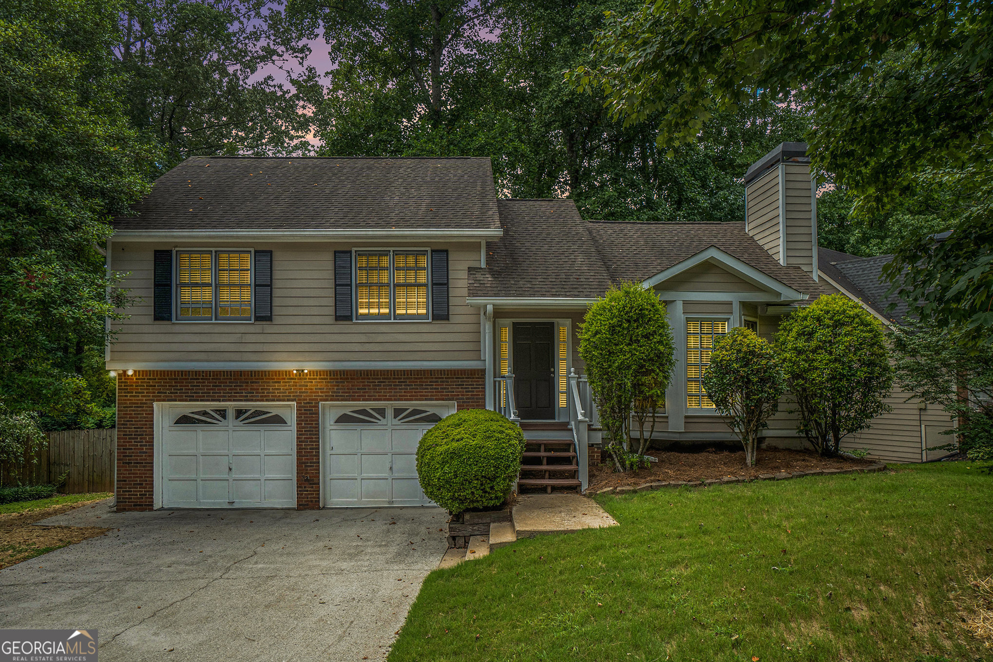 Welcome to this move-in ready gem, perfectly tucked away on a peaceful cul-de-sac in the highly sought-after neighborhood of Country Walk! From the moment you step inside, you'll love the bright, open spaces accented by fresh paint and stylish finishes throughout. The main level features gorgeous, low-maintenance laminate wood floors and an inviting living room with soaring vaulted ceilings, a striking accent wall, bay windows that flood the space with natural light, and a cozy fireplace-ideal for relaxing after a long day. Entertain with ease in the spacious dining area with seamless access to the outdoor deck. The kitchen boasts on-trend white cabinetry and ample counter and storage space for all your cooking needs. Upstairs, retreat to the serene primary suite complete with laminate wood flooring and a private en-suite bath featuring a tub/shower combo. Two generous secondary bedrooms and a full bath provide plenty of room for family or guests. Step outside to a fully fenced backyard backing to serene woods for ultimate privacy. Enjoy an upper-level deck perfect for gatherings and a covered lower area ideal for storage. Living in Country Walk means more than just a home-it's a lifestyle! Take advantage of incredible amenities, including a pool, tennis courts, basketball, pickleball, playground, and even a charming Country Store with gas pumps! Outdoor enthusiasts will love direct access to the Silver Comet Trail via the nearby Lucille Creek Trailhead. Plus, you're just minutes from downtown Powder Springs for shopping, dining, and entertainment.