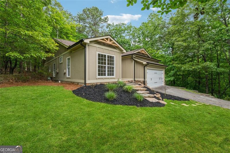 Welcome home to this craftsman ranch in the woods! Have you been looking for a new home on an established cul-de-sac lot? Look no further! This essentially brand-new home features 3 bedrooms, 2 full bathrooms and nearly 1,800sf of living space. As you enter through the welcoming front porch you can't help but notice the amazing attention to detail. From the front door, you are greeted into the grand open concept living space with vaulted ceilings! The large kitchen island is the focal point, with beautiful new white cabinets and a white quartz countertops. This kitchen is a showstopper and will be a great space for entertaining! The ground level living space is perfect, and very spacious. Each room has custom built-in closet shelving. The large, shaded back deck is the perfect spot to wind down and relax as you watch the deer meander through the woods. This home has been completely renovated by the same builder that does most of the new construction in Lake Arrowhead, so the build quality and reputation is something you can trust. Come check it out!