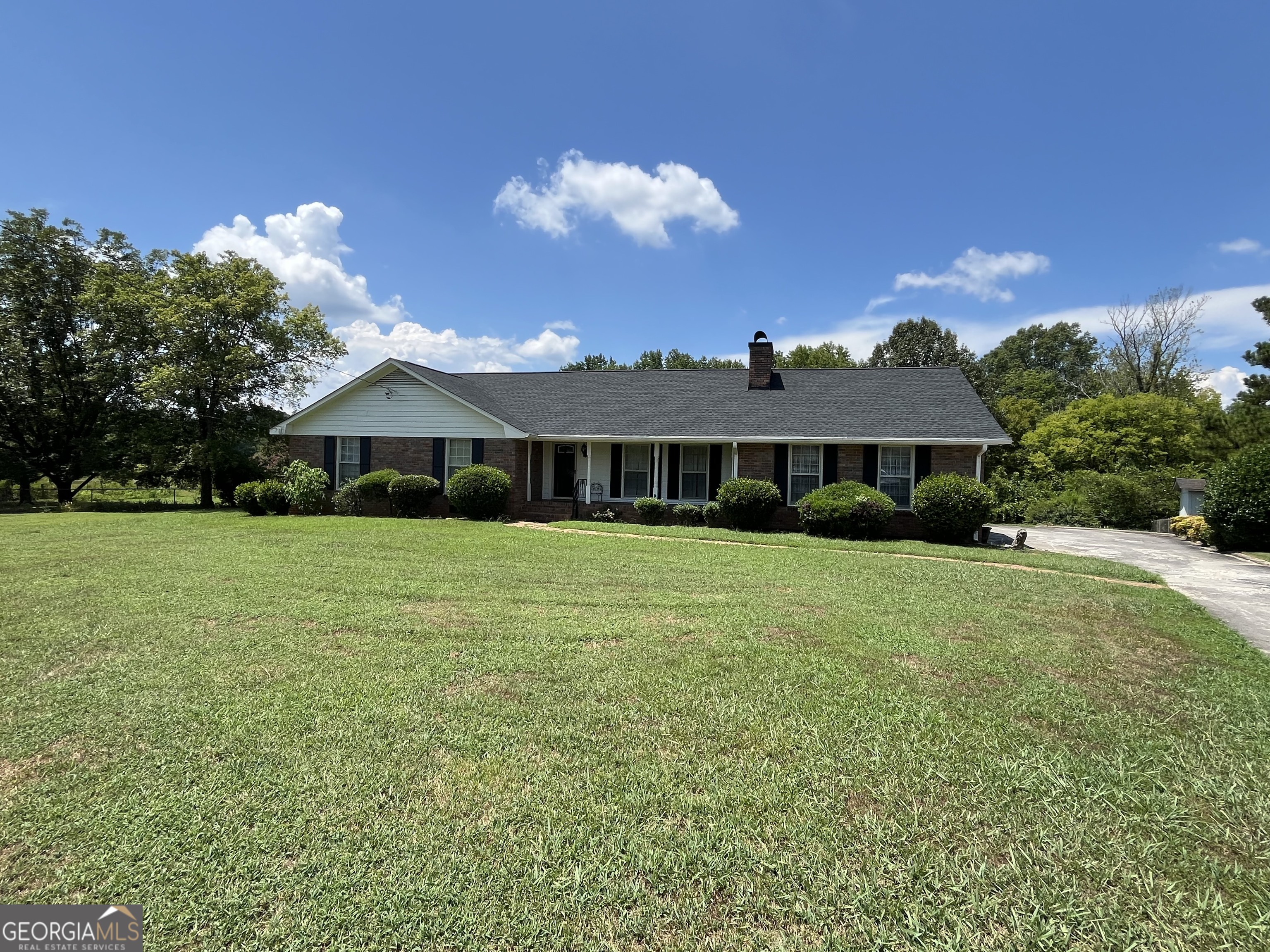 Hard to find 4 sided brick home in Maplewood Square subdivision. Large .6 acre lot with fenced in back yard that overlooks a pasture that runs along the Etowah river. This location provides privacy, quiet and beautiful sunsets in the evening that is enjoyed from the screened in porch. The living area includes a large living room, separate dining room and den. In the carport area is a 14'x14' storage room with power that has been used as an office in the past. Beautiful hardwood floors throughout.