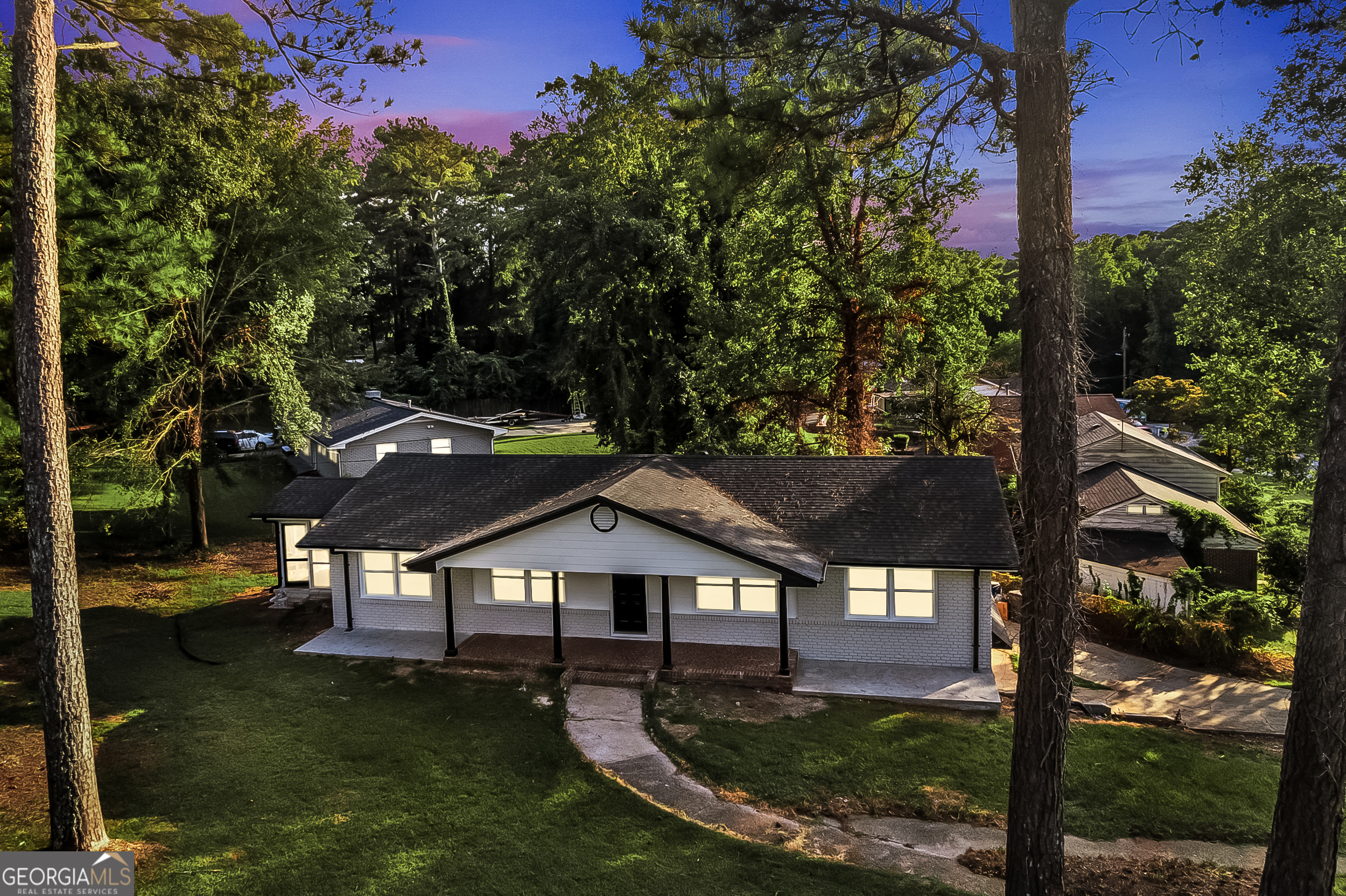 This fully remodeled 2,861 sq. ft. home offers modern design, functionality, and endless possibilities. The open floor plan highlights beautiful hardwood floors throughout, a brand-new kitchen with new appliances, a large island, and updated bathrooms with stylish finishes. The home features two spacious living rooms; one on the main floor and another in the finished basement, which can easily be converted into a bedroom or flex space. With plenty of room to entertain, work, or relax, this layout is perfect for today's lifestyle. Situated on a corner lot, the property provides extra space and future potential for outdoor living, gardening, or expansion. Conveniently located just minutes from Hartsfield-Jackson Atlanta International Airport, shopping, and dining, this home combines comfort and convenience in one package. Don't miss the chance to own this stunning East Point gem!