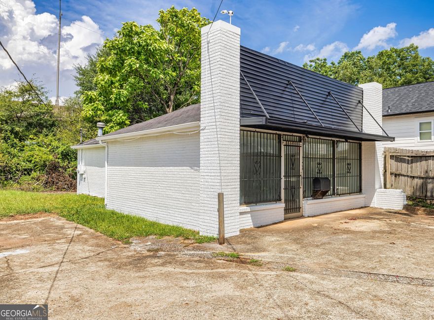 Rare opportunity in East Point for sale or lease. Zoned R-1, retail single occupancy, and recently built out to include 3 suites (or may build to suit, updated pics coming week of 11/22), freshly painted inside and out, and nestled on a prominent corner of the Jefferson Park neighborhood in ever-growing, rapidly expanding East Point, GA. GDOT data shows YOY increase in area daily traffic counts for previous 4 years; located just minutes from I-285/75, very short drive/walk to public transit, less than 5 miles from Hartsfield-Jackson Intl. airport, and only 5 min. to Tyler Perry Studios. Connections for W/D and addtl. sink make this a perfect potential music studio, 2 condominiums, or salon (plans and architectural drawings available at addtl. cost for each of these business uses--we've done the hard part for you!) Some other potential uses include professional office, coffee shop or bakery, barber shop/nail salon/lash lounge, massage parlor or dog spa, yoga studio or gym, boutique, etc. If you're ready to get out of your kitchen, van, basement, or garage, bring your contractor and your ideas and let's get down to business.