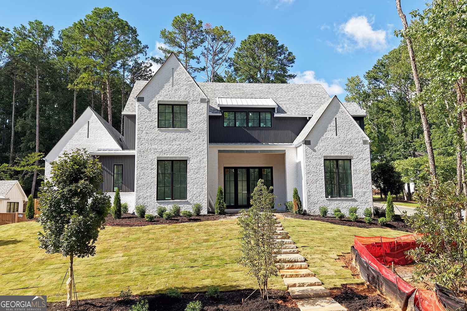 ** ANOTHER BEAUTIFUL NEW CONSTRUCTION HOME BUILT BY MODERNIZE PROPERTIES IN WALKABLE DOWNTOWN ALPHARETTA ** 12 foot ceilings throughout main level. Stunning covered outdoor living space with built-in kitchen. Perfect pool lot with ultimate privacy. Primary bedroom on main with soaring vaulted ceiling. Additional guest suite on main with private bath. Open floor plan with oversized kitchen island, scullery, lots of cabinets. Large sliding glass doors from family room to outdoor oasis. Second story with vaulted loft, 3 bedrooms with private baths, huge bonus room with full bath and closet that could be 4th bedroom/ home theater/ workout room/ home office etc. Luxury finishes throughout. 3-car garage. Spray foam insulation. Tankless water heater. Still time to make selections. Completion late summer.