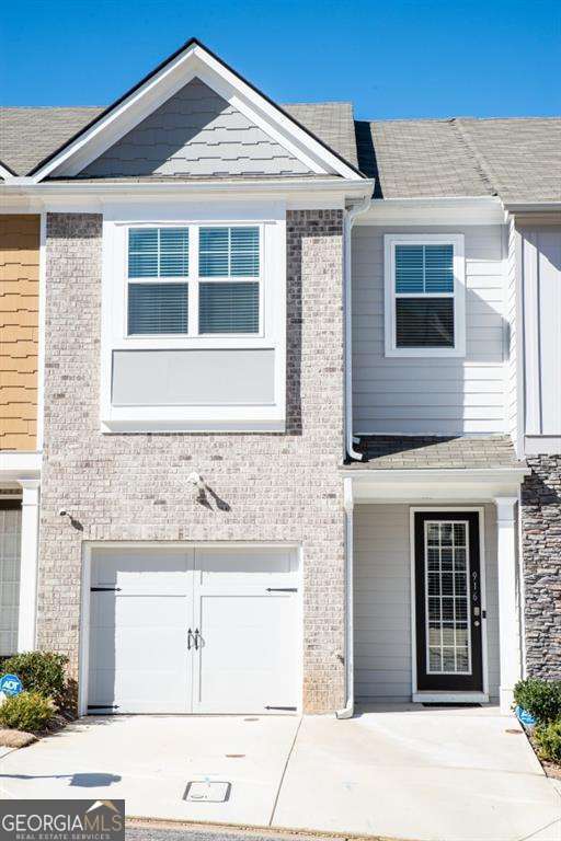 This three-story townhome was built in 2021. This rental townhome has so much to offer! Access to the major highways. Walking through the front door, there is a wide entry with arched hallway creating a grand entrance into the first floor. There is hardwood throughout the main floor. This 3 bedroom 2.5 bath has a deck off of the dining area + a fireplace in the living room. The open concept kitchen and dining combo has a kitchen island, 42 inch cabinets, beautiful granite counter tops & stainless steel appliances. In addition, the unfinished basement leads out to a private fenced backyard. Upstairs, there are two great secondary bedroom. The third, the owner's room is oversized with a walk-in closet. Owner's en-suite features separate shower/tub, dual vanity and tile flooring. The laundry is conveniently located upstairs.