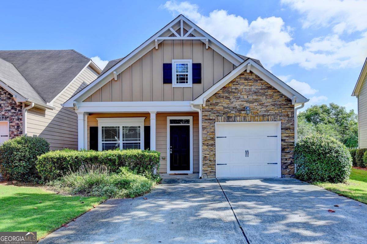 This charming craftsman-style single-family home offers the perfect blend of comfort and convenience. Featuring 3 bedrooms, 2.5 baths, and a soaring two-story great room, it's designed for both style and function. Freshly updated with brand-new carpet, the main-level primary suite provides ease and privacy, while upstairs you'll find two oversized secondary bedrooms, both with walk in closets and a separate sitting area, sharing a full jack and Jill bath. Enjoy a private backyard, open to pasture views, with the community clubhouse, pool, and playground a short distance. Conveniently located off GA-400, you're close to the North Georgia Premium Outlets, shopping, dining, and only a short drive to the Blue Ridge Mountains-making this home the ideal mix of peaceful retreat and everyday convenience. As a bonus, this property allows rentals, offering flexible options whether you're looking for a full-time residence, a second home, or an investment opportunity.