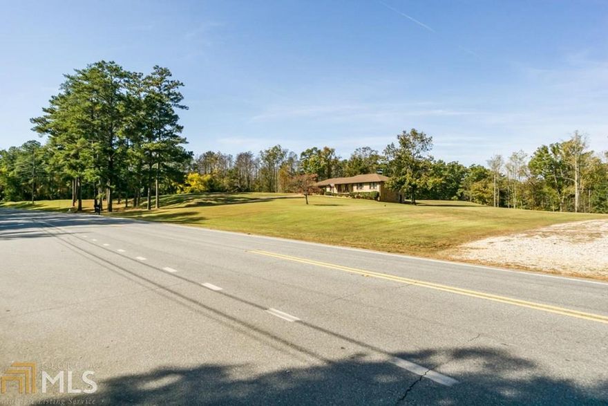 7.7 +/- acre estate is being presented for only the 2nd time in the past 80 years. INCREDIBLE ONCE IN A LIFETIME OPPORTUNITY to own a piece of Prime RE in a prestigious upscale community surrounded by luxury homes/gated estates and LISTED UNDER APPRAISED VALUE! The estate is surrounded by some of Atlanta's most notable athletes, movie stars, entertainers, and corp. exec's. Plus it is magically unrefined with privacy and world-class amenities are easily accessible. It can be subdivided into 4 lots, is open w/grassy cover, level to gently rolling topo, and 680 =/- ft. of RD frontage.