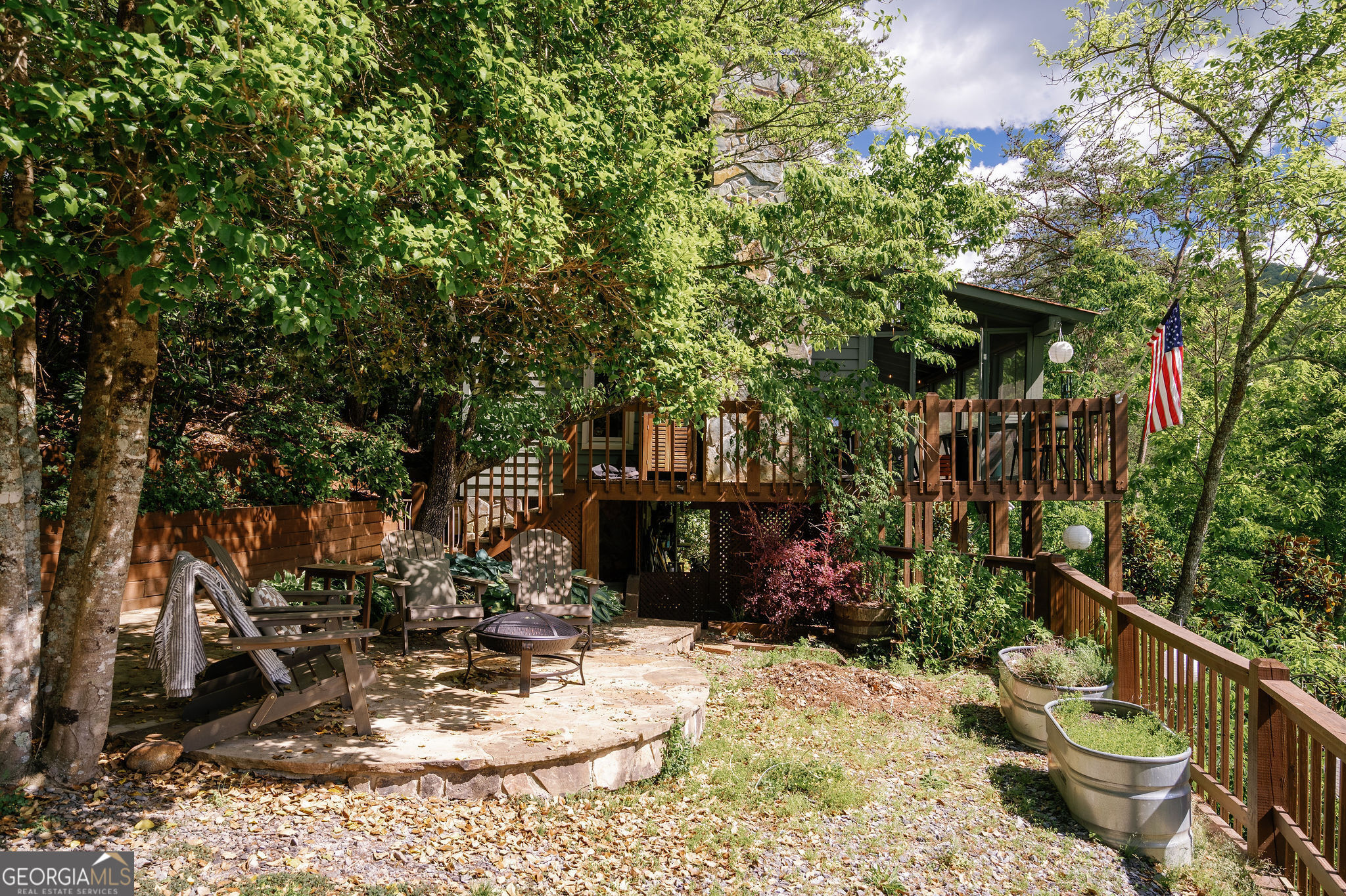 There's luxury in the details! If you're dreaming of a gated home with stunning water frontage and breathtaking mountain views, this listing is your perfect match! Priced to make entering the short-term rental market achievable without breaking the bank, this charming cabin offers incredible value. Located in the desirable Cherry Log, GA, it boasts creek frontage, sweeping vistas of Rich Mountain Preserve with both close-up and long-range mountain views-all in an unbeatable setting. The well-maintained 2-bedroom, 1-bath layout (with the second bedroom being a cozy loft) features continuous soothing sounds of Little Rock Creek, creating a tranquil ambiance. This cozy cabin is beautifully crafted inside with an all-wood interior, hardwood floors, a metal roof, and a stone gas-log fireplace. The cathedral ceiling accentuates the open, airy feel, while a screened rocking chair porch with a swing add relaxing touches. The spacious porch invites you to soak in the stunning scenery, whether sipping coffee or unwinding after a day of exploring. The main-level bedroom is bathed in mountain views through the windows, and the bathroom showcases elegant granite countertops. Upstairs, the versatile loft with two beds is perfect for children or guests, also offering spectacular mountain outlooks. Additional highlights include a gated driveway, ample parking, and a fire pit for cozy gatherings. Inside, you'll find beautifully finished rustic details that blend function with charm-making this an ideal investment for starting or growing your short-term rental portfolio, while enjoying your own mountain retreat.