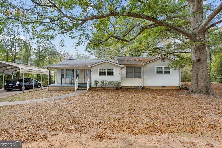 Ranch Home on a 1.2 Acre Lot! Located in Sought-After Marietta, this home is situated near Marietta Square, Downtown Kennesaw, Kennesaw Mountain State Park, and more. Perfect for a Savvy Buyer or Investor, this home presents a wealth of Potential and Opportunity for Updating or Rebuilding! Upon Entering, you'll find a flowing floorplan that seamlessly connects the Family Room and Kitchen. An adjacent Sunroom leads way onto the Back Porch, a perfect layout for indoor-outdoor entertaining. With Three Bedrooms and One Bathroom, there's plenty of space for everyone. Outside, you'll discover a Large, Flat Backyard providing plenty of room for Pets, Play, Gardening, or Expansion plans. Minutes to Shopping, Dining, and Entertainment with Easy Highway Access!