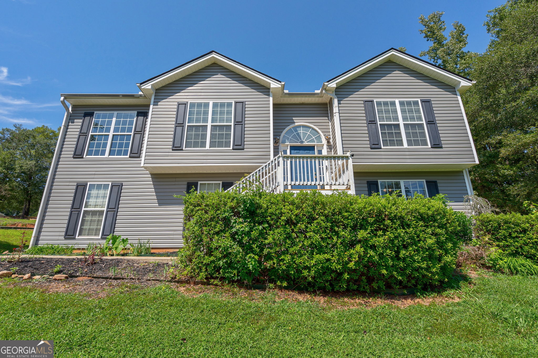 Welcome to this spacious 5BR/3BA home in Statham, GA, nestled on a beautiful 0.67-acre sloping lot. This split-level floor plan offers versatility and room to grow. The upper level features living room with vaulted ceilings and natural light, dining room, an eat-in kitchen, and three bedrooms including a generous master suite. The lower level provides even more living space with two additional bedrooms, a full bathroom, a comfortable living area, and a convenient kitchenette, making it ideal for guests, extended family, or a private home office. Step outside to enjoy a screened-in porch and deck overlooking the partially fenced backyard. Perfect for relaxing or entertaining. With plenty of space inside and out, this home offers endless potential. Move right in and add your personal touches over time to make it truly reflect your style. Don't miss the opportunity to make this flexible and inviting property your new home!
