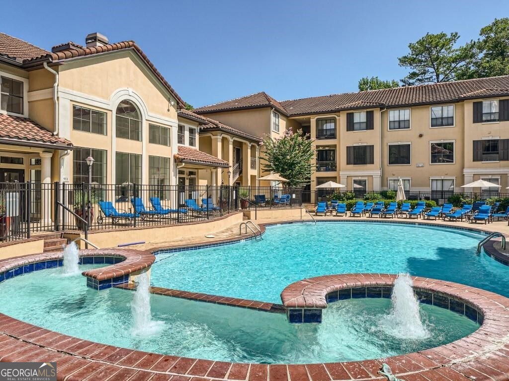 Don't miss this spacious 2BR/1.5BA condo in the heart of Brookhaven. Situated on the first floor, it offers convenient access to all of Peachtree Place's amenities, and it's a great fit for pet owners with easy walk-out access for quick trips outside. Inside, you'll find hardwood floors throughout, granite countertops, stainless steel appliances, and covered patio. The primary suite features a double vanity, soaking tub, and two oversized walk-in closets with custom shelving. The second bedroom is perfect for a home office, guest room, or flex space. Enjoy two private porches and covered parking right outside your door, plus plenty of guest parking! Community perks include gated entry, a resort-style pool, newly renovated two-level fitness center, business center, club room, theater room, and leash-free dog park. All appliances are included, along with water, sewer, and trash valet. Nestled in the middle of all Buckhead and Brookhaven have to offer, this home boasts unbeatable proximity to GA 400 and I-85, Lenox and Phipps Malls, and is just minutes from endless shopping and dining options. Pets allowed!