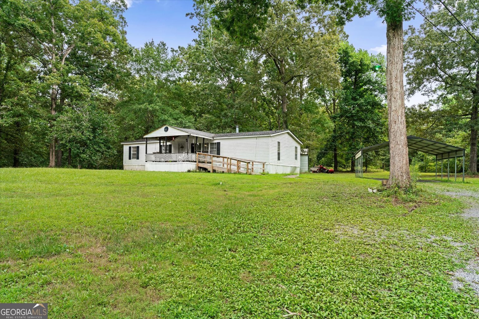 Charming 3-Bed, 2-Bath Home on 2.61 Acres with Workshop & Permanent Foundation Welcome to this spacious 1,680 sq ft 3-bedroom, 2-bathroom mobile home, perfectly situated on 2.61 peaceful acres. This well-maintained home sits on a permanent foundation, giving you the stability of a traditional home with the flexibility of country living. Inside, you'll find a roomy layout featuring a 5-ton central HVAC system installed just 7 years ago, ensuring comfort year-round. Two of the bedrooms feature updated flooring just 5 years old, adding a fresh touch to the space. The roof was replaced 4 years ago, offering peace of mind for years to come. Step outside and enjoy the convenience of a covered carport and a detached garage that's perfect for hobbyists or anyone needing a serious workspace. The garage is equipped with power, 6-8 inch thick Concrete flooring, and a dedicated welding connection-ideal for automotive repairs, fabrication, or creative projects right at home. Whether you're looking for a quiet retreat, space to grow, or a place to work and relax, this property has it all.