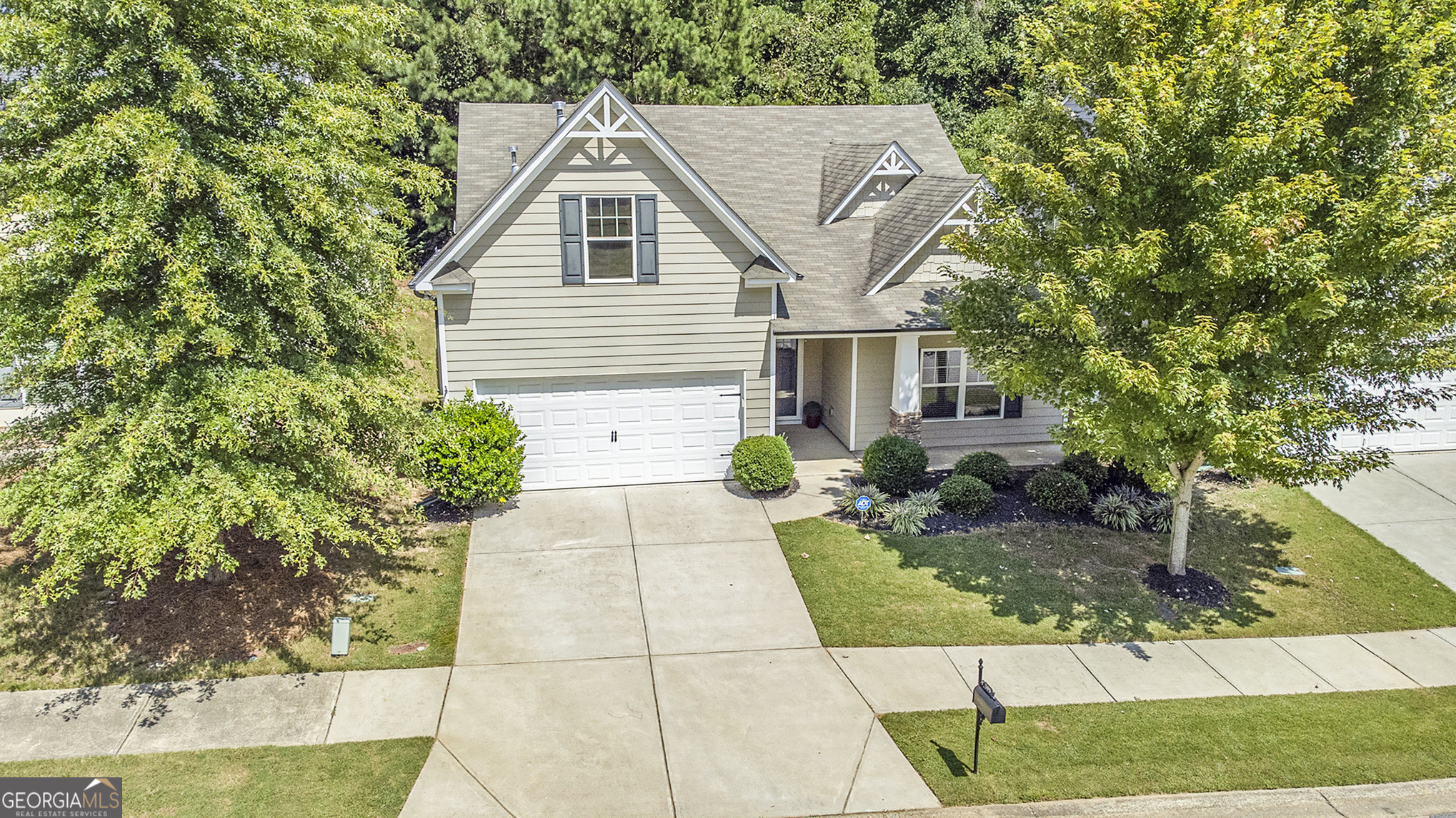 Are you 62+ years old this year? Ask about Cherokee County Senior School Tax Exemption benefits for buying before end of year! STEPLESS RANCH Craftsman with rocking chair front porch! Enter the welcoming foyer, leading to an open floor plan perfect for entertaining. The kitchen features a large working island with seating for six, a large walk-in pantry, stainless steel appliances, and a separate nook for a breakfast table. The kitchen opens to a large dining area, sunroom/flex space, and great room. The oversized primary bedroom features tray ceilings and a gorgeous wood barn door that opens to the spa-like bathroom. The primary bath features dual vanities, a walk-in shower with glass doors, a window with plenty of natural light, and a spacious walk-in closet. Two secondary bedrooms and a full bath complete this floor plan. Step outside to relax on the patio inside the fenced yard - perfect for grilling. Located in the Cherokee High School District. Neighborhood amenities include a clubhouse, large swimming pool, fitness center, playground, basketball, and hiking trails. Convenient to I-575, the Hickory Log Creek Reservoir & Downtown Canton.