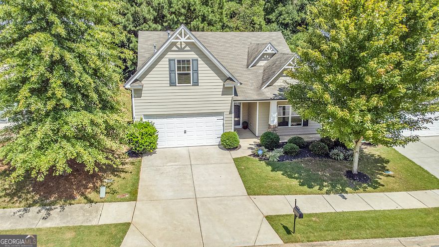 Are you 62+ years old this year? Ask about Cherokee County Senior School Tax Exemption benefits for buying before end of year! STEPLESS RANCH Craftsman with rocking chair front porch!  Enter the welcoming foyer, leading to an open floor plan perfect for entertaining. The kitchen features a large working island with seating for six, a large walk-in pantry, stainless steel appliances, and a separate nook for a breakfast table. The kitchen opens to a large dining area, sunroom/flex space, and great room. The oversized primary bedroom features tray ceilings and a gorgeous wood barn door that opens to the spa-like bathroom. The primary bath features dual vanities, a walk-in shower with glass doors, a window with plenty of natural light, and a spacious walk-in closet. Two secondary bedrooms and a full bath complete this floor plan. Step outside to relax on the patio inside the fenced yard - perfect for grilling. Located in the Cherokee High School District. Neighborhood amenities include a clubhouse, large swimming pool, fitness center, playground, basketball, and hiking trails. Convenient to I-575, the Hickory Log Creek Reservoir & Downtown Canton.