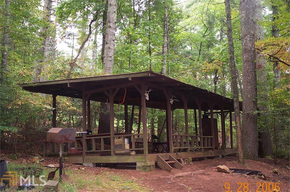 PLAT NOW ON LINE! PRIVATE POND AND QUIET GET AWAY! ESTABLISHED BACK IN THE 1960'S, THIS MOUNTAIN ESCAPE STILL OFFERS PEACE AND QUIET, FISHING AND MORE! SOME IMPROVEMENTS INCLUDING A SEPTIC SYSTEM AND WELL. NEITHER HAVE BEEN USED FOR 20 YEARS OR SO, SO NO WARRANTIES. BEAUTIFUL SPRING FED POND ON WHICH TO WHILE AWAY YOUR SUMMER AFTERNOONS! NEAR NATIONAL FOREST AND STILL ON A PAVED ROAD! Pond not shown on plat but is located on center line of branch as located on plat.
