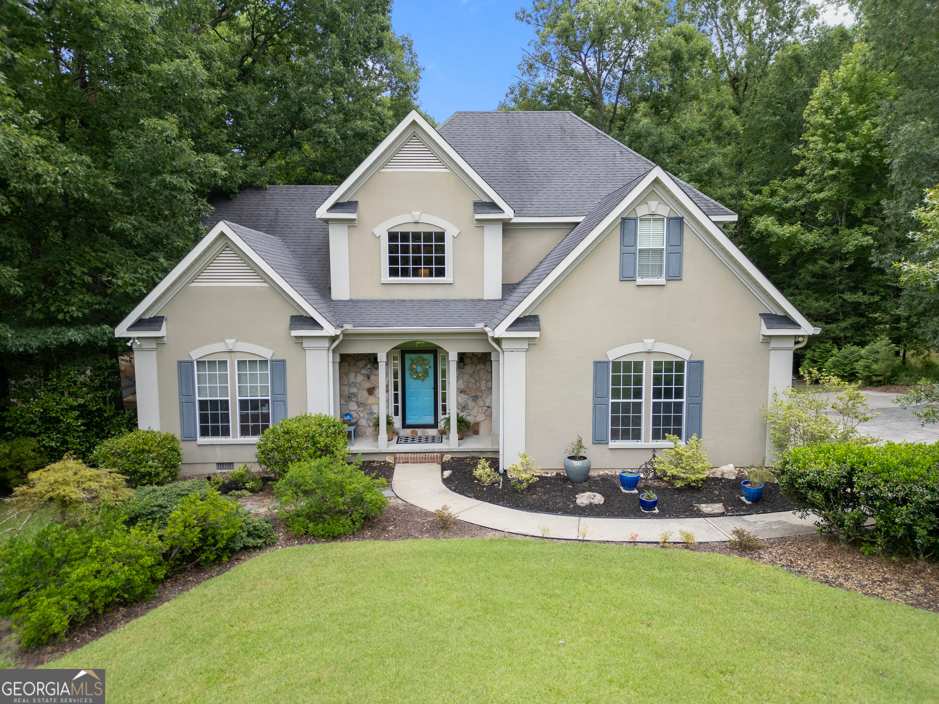 Custom-Built Lake Tobesofkee Home with Designer Upgrades! Move-in ready and meticulously maintained by its original owner, this stunning custom-built home offers lake access and refined living just steps from Lake Tobesofkee. With hardwood floors throughout both levels, this 3-bedroom, 2-bathroom residence includes an office, two spacious living areas, a cozy family room, and a sunroom with beautiful views of the private garden. The show stopping chef's kitchen is a dream come true-fully remodeled with abundant custom cabinetry featuring pull-out shelves, Kohler farmhouse sink, Bosch built-in dishwasher, Corian and granite countertops, Sub-Zero refrigerator, and Thermador gas stove-ideal for entertaining. Retreat to the luxurious owner's suite with an enormous walk-in closet, separate shower, and double vanity. Interior highlights include a cozy gas log fireplace, upgraded HVAC unit, and thoughtful designer finishes throughout.