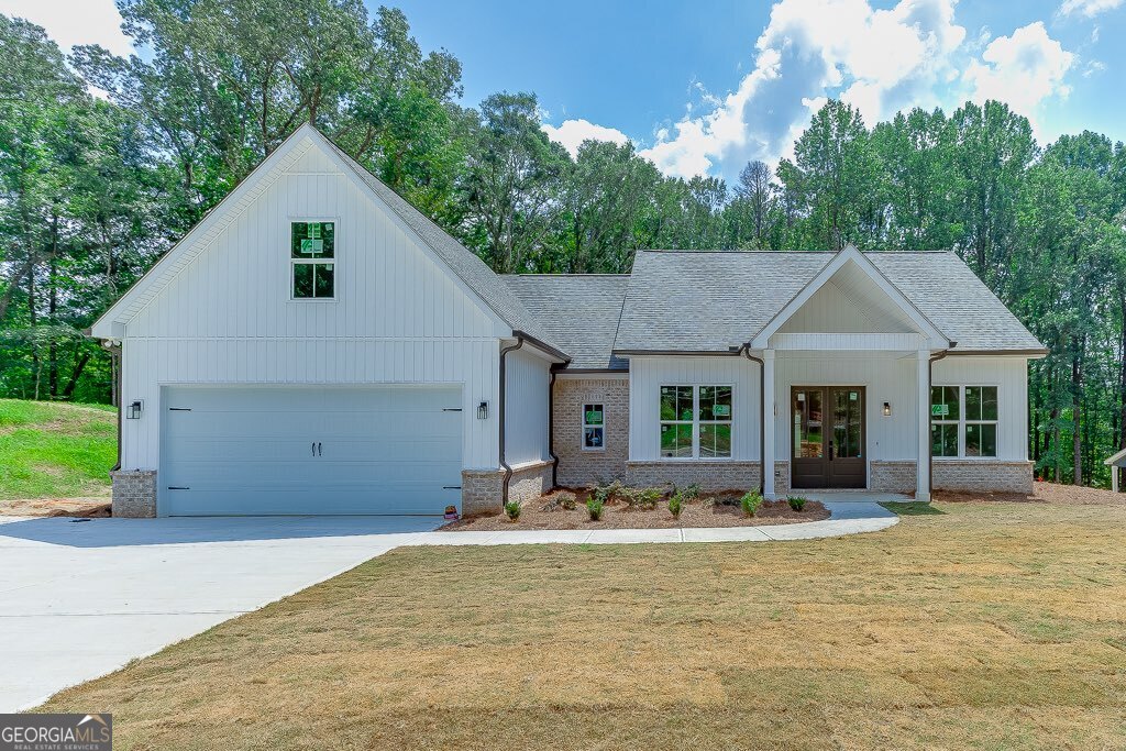 Located in one of the most sought-after districts, Jefferson City Schools, this brand-new 5-bedroom, 2.5-bath home offers luxury and convenience. Featuring master on main, quartz countertops, white cabinets, a spacious kitchen island, and luxury vinyl flooring throughout, every detail has been professionally designed with upgrades galore. Large bedrooms and luxury bathrooms provide comfort, while a bonus room with its own heating and cooling adds flexible living space. Nestled on over 2 acres inside city limits-yet not in a neighborhood and with no HOA-you'll enjoy privacy, a large outdoor living area, and a private backyard. Ample driveway parking accommodates multiple vehicles, and the home's location places you just minutes from downtown Jefferson. With designer finishes, spacious living areas, and unmatched attention to detail, this property offers both modern elegance and everyday functionality.