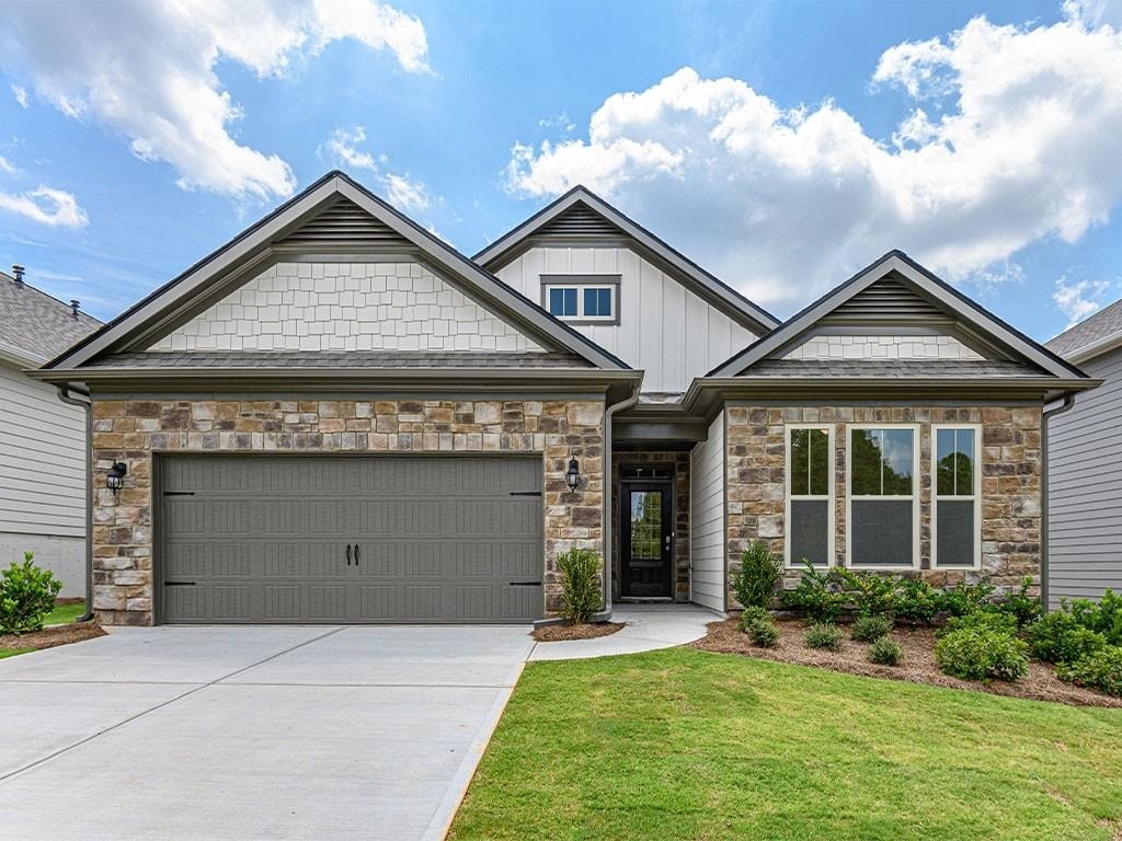 Open concept, 3 bed/2 bath ranch plan home on a basement! Chefs kitchen with double oven, antique white cabinets, quartz countertops and large island. Primary suite with oversized tile shower, dual vanity, tile floor and walk in closet. Rear deck. Community just minutes from the Outlet Shoppes at Atlanta and Lake Allatoona. Located in Bridgemill Heights, a gated community. HOA includes lawn maintenance and irrigation.