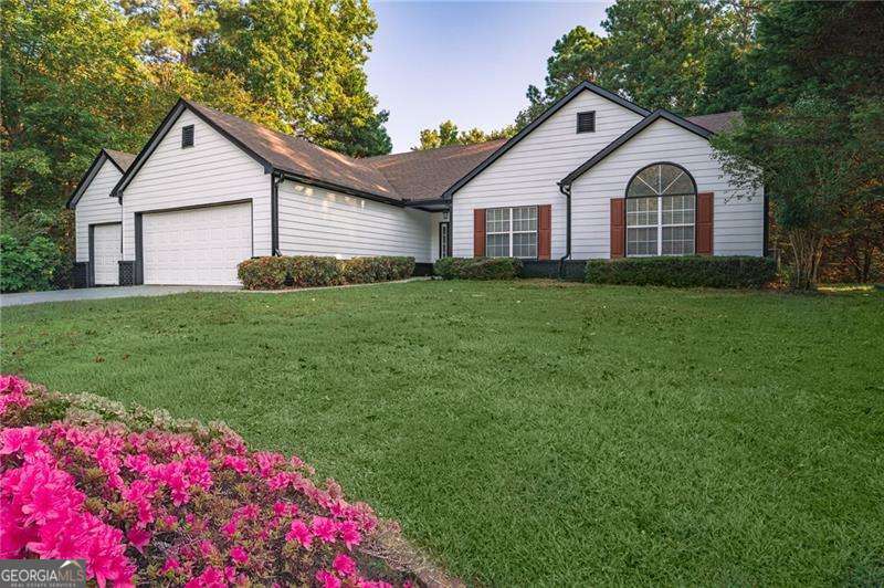 Charming Ranch-Style Home in Cherokee County right next to Lake Allatoona! Welcome to this stunning 3-bedroom, 2-bathroom ranch-style home, perfectly situated on nearly 1 acre in beautiful Cherokee County! This property offers the ideal blend of comfort and convenience, with spacious living areas and plenty of room to entertain both inside and out. Brand New Paint and Repairs made throughout the property. Key Features: 3 Bedrooms, 2 Bathrooms. Expansive 3-Car Garage. Open concept Family Room with cozy Gas Log Fireplace. Fully Equipped Kitchen with brand new appliances. Breakfast/Dining Area perfect for meals with family and friends. Gorgeous Air-Conditioned Sunroom that brings the outdoors in. Generously sized Back Deck ideal for relaxing or hosting gatherings. Located near the serene Lake Allatoona, offering recreational opportunities just moments away This home is ready for you to move in and make it your own. Don't miss the chance to see it in person-schedule a tour today and experience the warmth and charm this property has to offer!