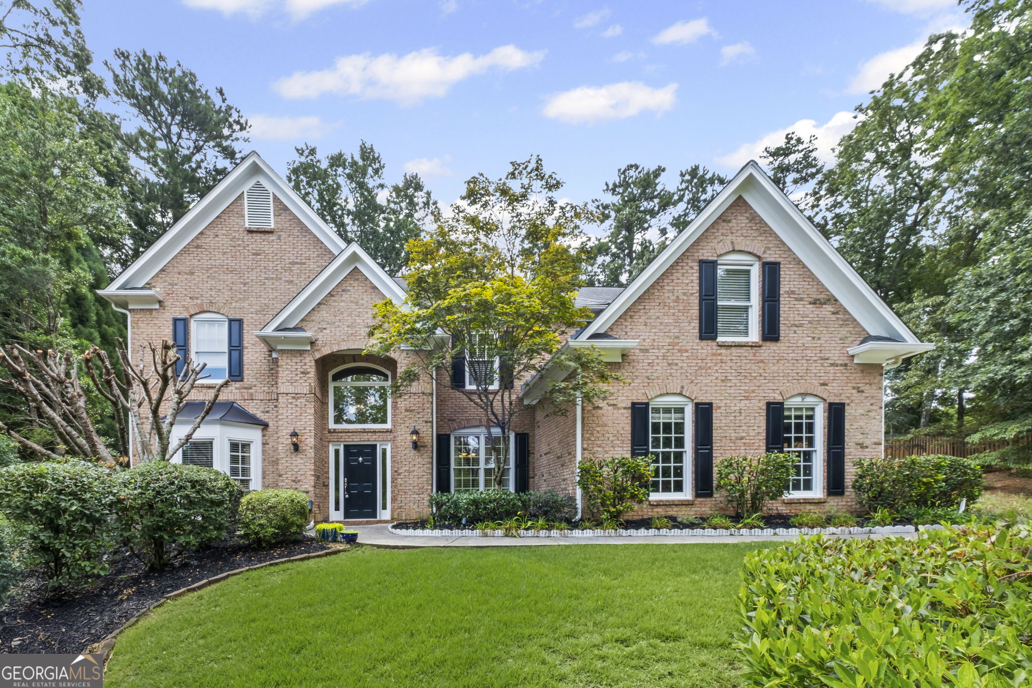 Stunning brick front home nestled in the heart of Alpharetta's highly sought-after community! This beautifully maintained residence at 1235 Legend Run offers 4 spacious bedrooms, 2 and half bathrooms, and ~2996 square feet of luxurious living space. The home features an open-concept layout, gourmet kitchen with granite countertops and stainless steel appliances, a sunlit 2-story family room with fireplace, Upstairs, enjoy a spacious owner's retreat with a spa-like bathroom, walk-in closet, and a private sitting area. Windows repaired/replaced (2023), exterior painted (2023), Interior painted(2025) garage door replaced (2023), stainless steel kitchen appliances installed (2023), LVP flooring added downstairs (2025), HVAC units replaced upstairs (May 2024) and downstairs (Aug 2024). The additional bedrooms are generously sized with ample closet space. Step outside to a private, fenced backyard ideal for gatherings or quiet relaxation. Located in a top-rated school district, just minutes from Avalon, Downtown Alpharetta, parks, shopping, and dining.