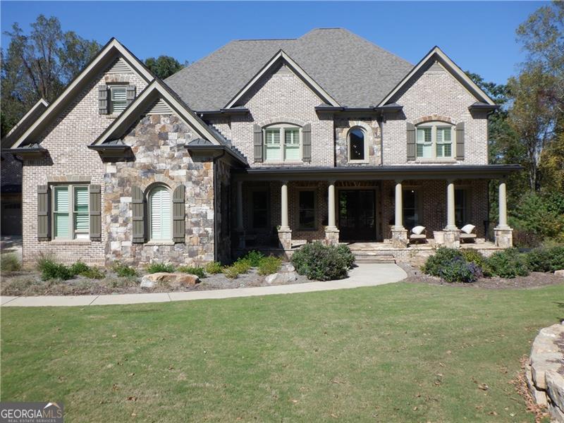 This Crown Jewell of Creekstone Estates. This home is situated on 1.2 acres, over 7,000 sqft finished, plus a carriage house with an apartment on the second level, and a FULL BA plus office/flex room on the terrace level with a "Safe Room" resort-style spa pool with slid
