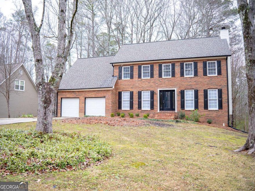 Updated and Move In Ready! Come inside and enjoy the spaciousness of this pretty four-bedroom home. This home features traditional living at it's best! Enjoy the benefits of both a formal dining room and a formal living room. Perfect for entertaining or flex space to simply hang out and relax. The main floor also includes a family room and a huge open Kitchen with a Breakfast room. When you're ready for some fresh air, step outside and enjoy the new deck overlooking your private back yard! The second floor is highlighted with an oversized Owner's Suite, which includes a trey ceiling, walk-in closet, and private bath. Three generous-sized secondary bedrooms and a full bath round out this beautiful home. Need more space... this home includes an unfinished basement that's begging to be your next DIY oasis! A few other details to know; New Kitchen Appliances, One yr old roof, new deck, interior and exterior paint, new flooring throughout and much more. Quiet community with a Home Owners Association and swimming pool for those hot summer days! Great Cobb County location that's close to everything. Come see it today.