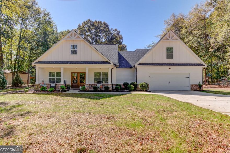 Built in 2021, this beautifully maintained 3-bedroom, 3.5-bath home offers over 2,400 square feet of thoughtfully designed living space on a private and wooded 1.35-acre lot. Enjoy peace and privacy while still being conveniently located near Social Circle, Covington, and Monroe.    Step inside to find an open-concept floor plan featuring spacious living and dining areas, high ceilings, and abundant natural light. The kitchen boasts modern finishes, ample cabinetry, and a center island perfect for entertaining. A cozy fireplace anchors the living room, making it the perfect place to unwind.    The large primary suite offers a spa-like bath and generous closet space. Additional bedrooms are well-sized and each includes its own bath or convenient access, ideal for family or guests.    Outside, enjoy the expansive lot surrounded by mature trees?offering space to garden, play, or relax in your private outdoor retreat. With a blend of modern construction, quality finishes, and serene surroundings, this home is truly move-in ready.    Don?t miss your chance to own a like-new home in a peaceful, sought-after location!