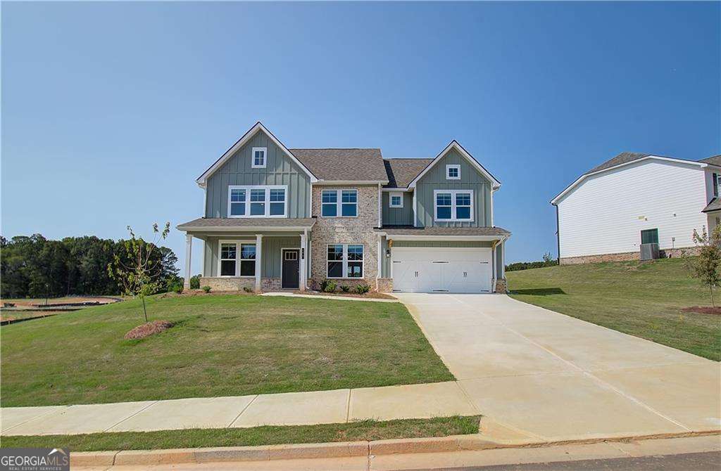 Welcome home to Grandview Community in sought-after Henry County by DRB Homes! No detail has been overlooked in this beautiful single-family home community featuring exquisite brick and craftsman-style exteriors. Our spacious Stonefield floor plan (Lot 110) offers 5 bedrooms and 3.5 bathrooms, with an open layout on the main level that includes a formal dining room and a study. The stunning kitchen boasts an expansive island with quartz countertops, elegant 42-inch cabinets, and a generous walk-in pantry. A private ensuite is also included on the main floor, along with a separate powder room. Upstairs, you'll find a welcoming loft leading to the owner's suite, complete with a cozy sitting room, oversized walk-in closet, large shower, and separate tub. Three additional spacious bedrooms and a convenient laundry room complete the upper level. Please note that the images included are stock photos of a spec home and may not represent the actual home. Colors, features, options, materials, and lot views may vary. Don't miss this incredible opportunity to make Grandview your new home! Please note: If the buyer is represented by a broker/agent, DRB REQUIRES the buyer's broker/agent to be present during the initial meeting with DRB's sales personnel to ensure proper representation.
